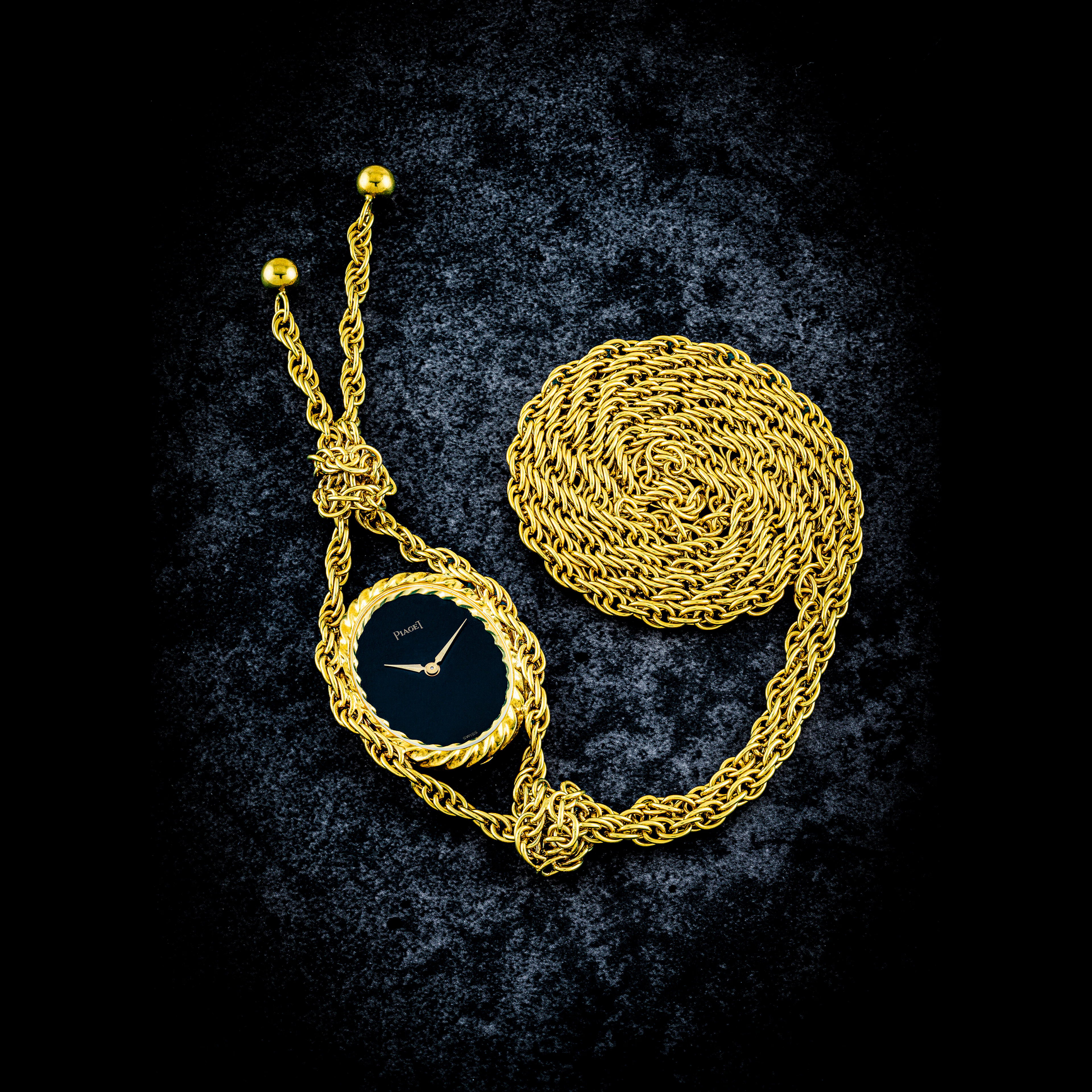 PIAGET. AN 18K GOLD OVAL SHAPE PENDANT WATCH WITH NECKLACE AND ONYX DIAL