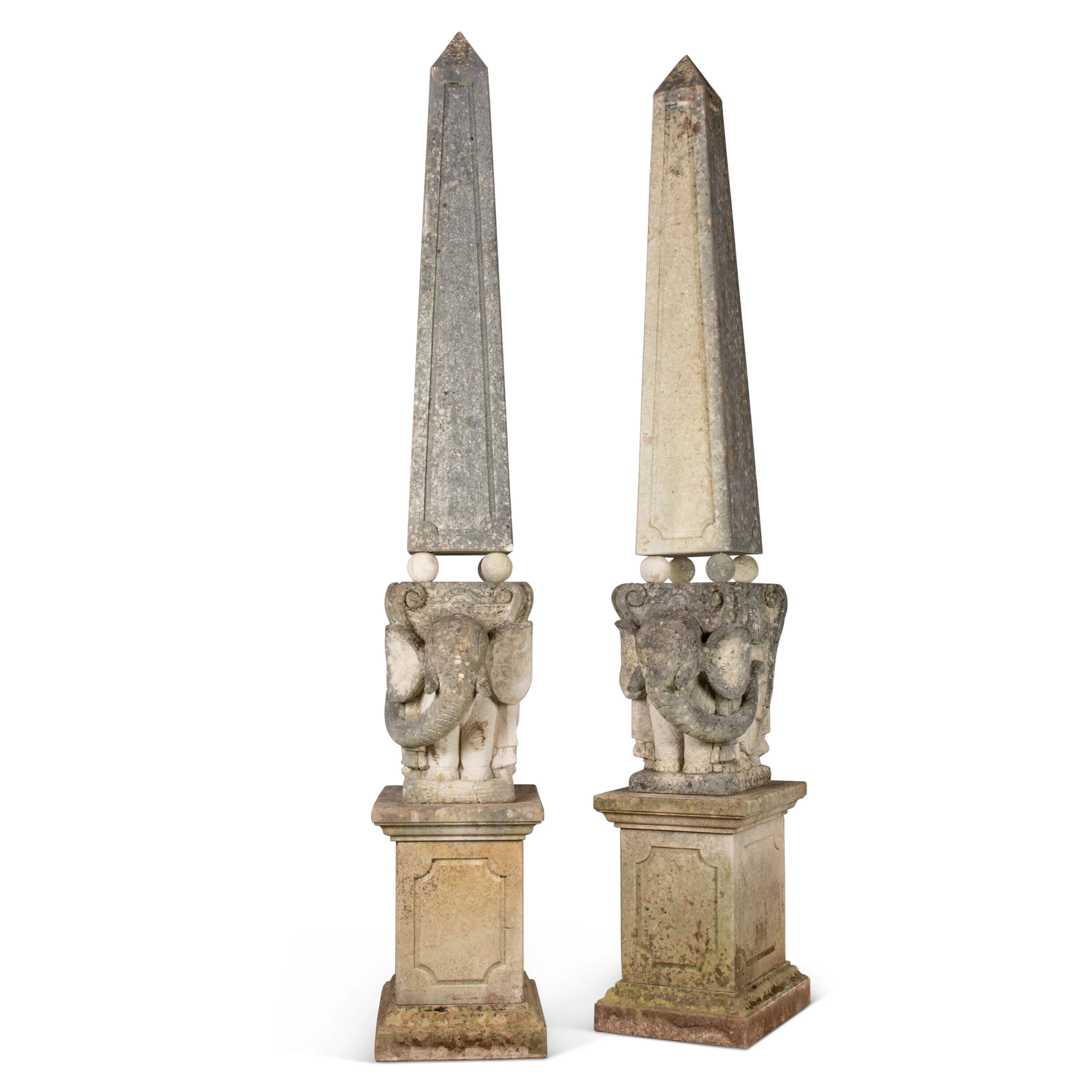 A PAIR OF CARVED LIMESTONE OBELISKS