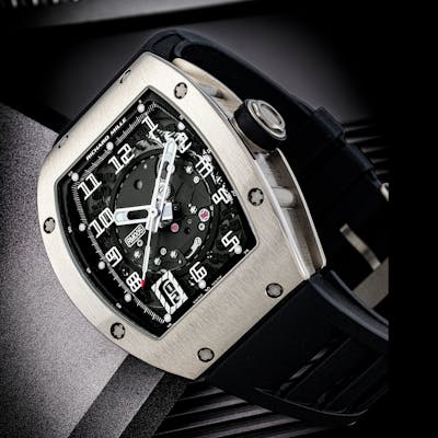 RICHARD MILLE. AN 18K WHITE GOLD AUTOMATIC SEMI-SKELETONISED WRISTWATCH