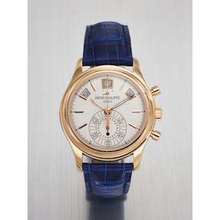 PATEK PHILIPPE. AN ATTRACTIVE 18K PINK GOLD AUTOMATIC ANNUAL CALENDAR