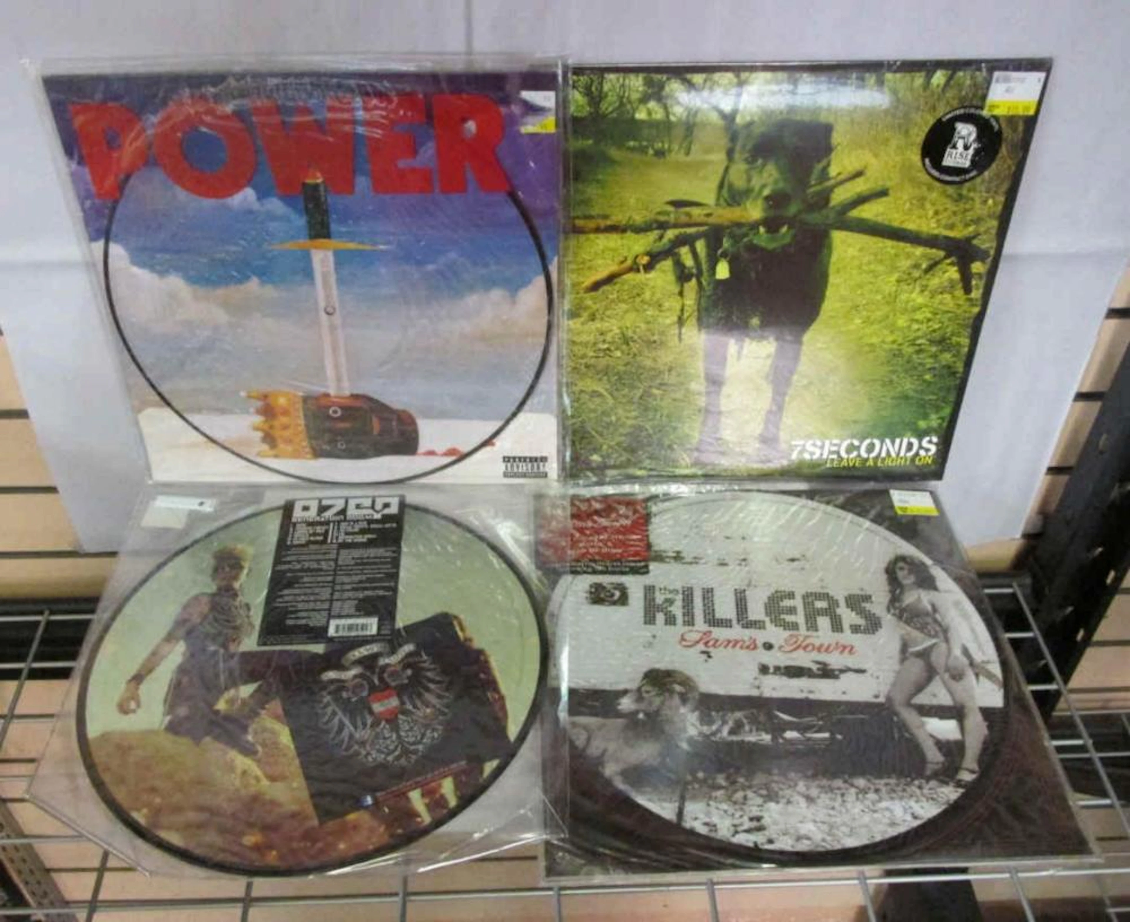 Four Unframed Picture Discs