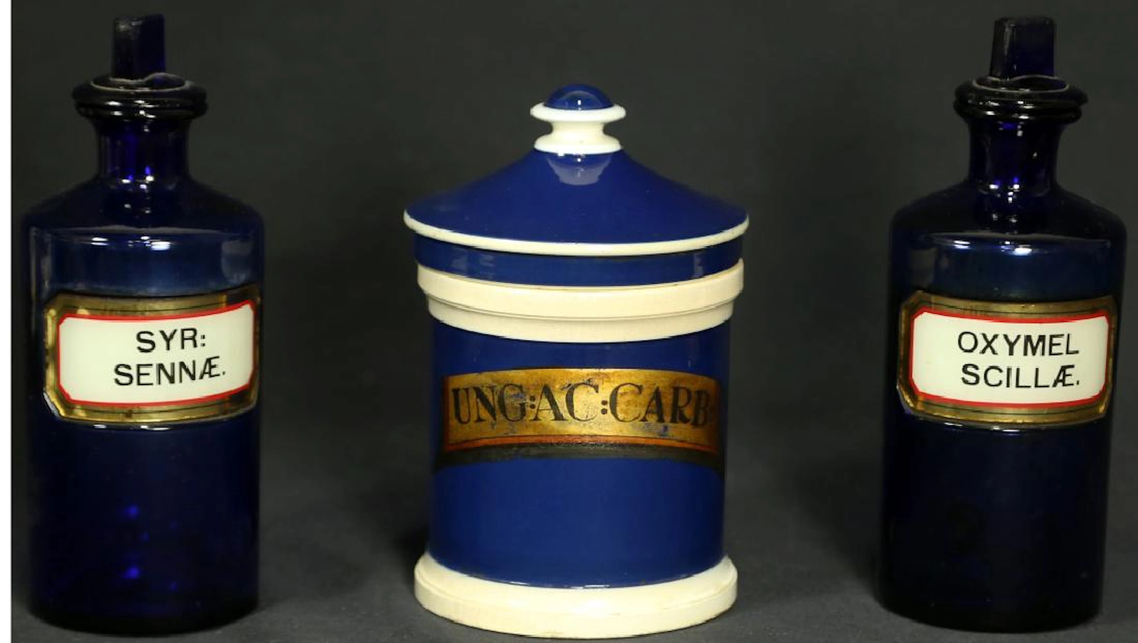Set of three apothecary jars. two glass, one porc.
