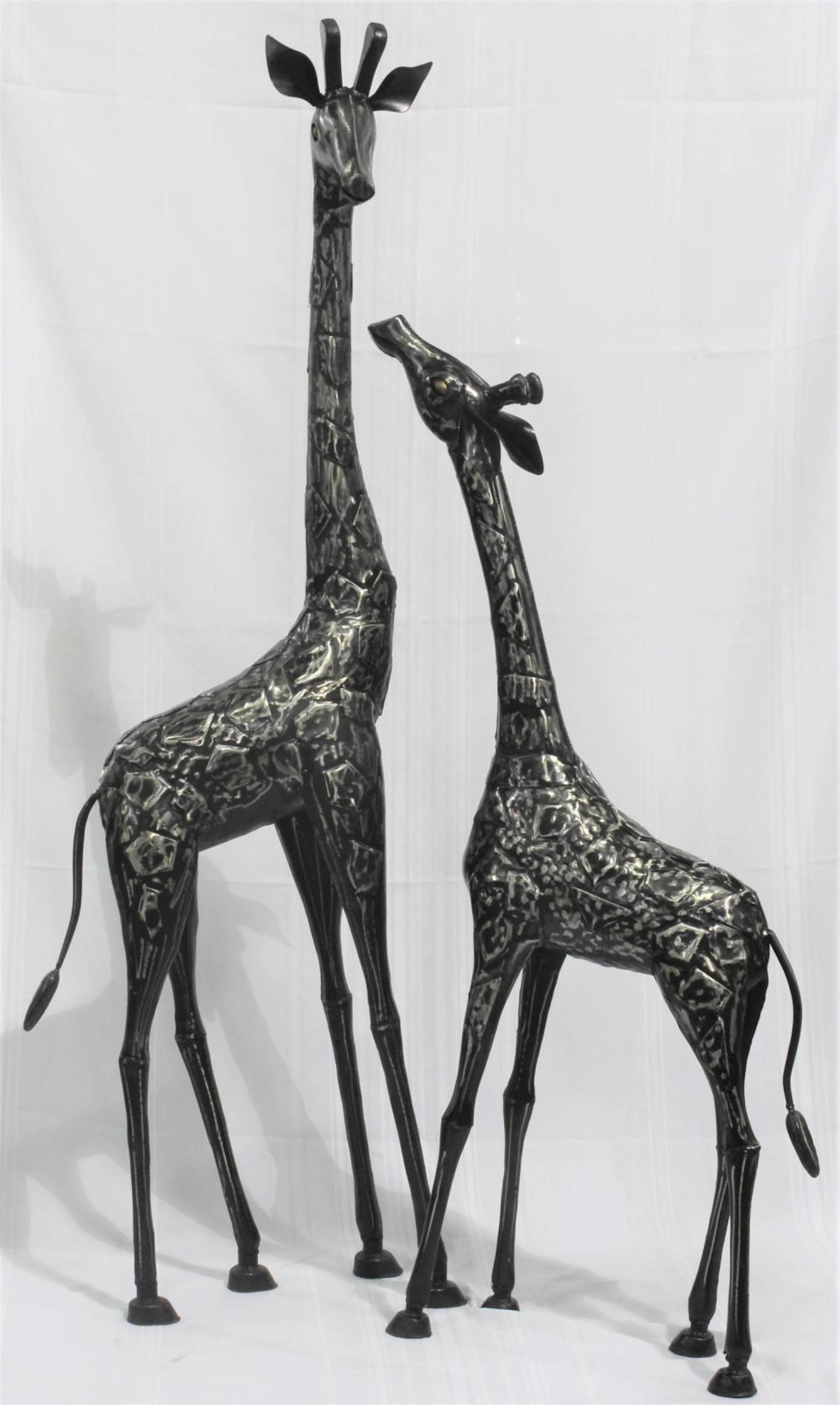 Pair of Metal Giraffe Sculptures.