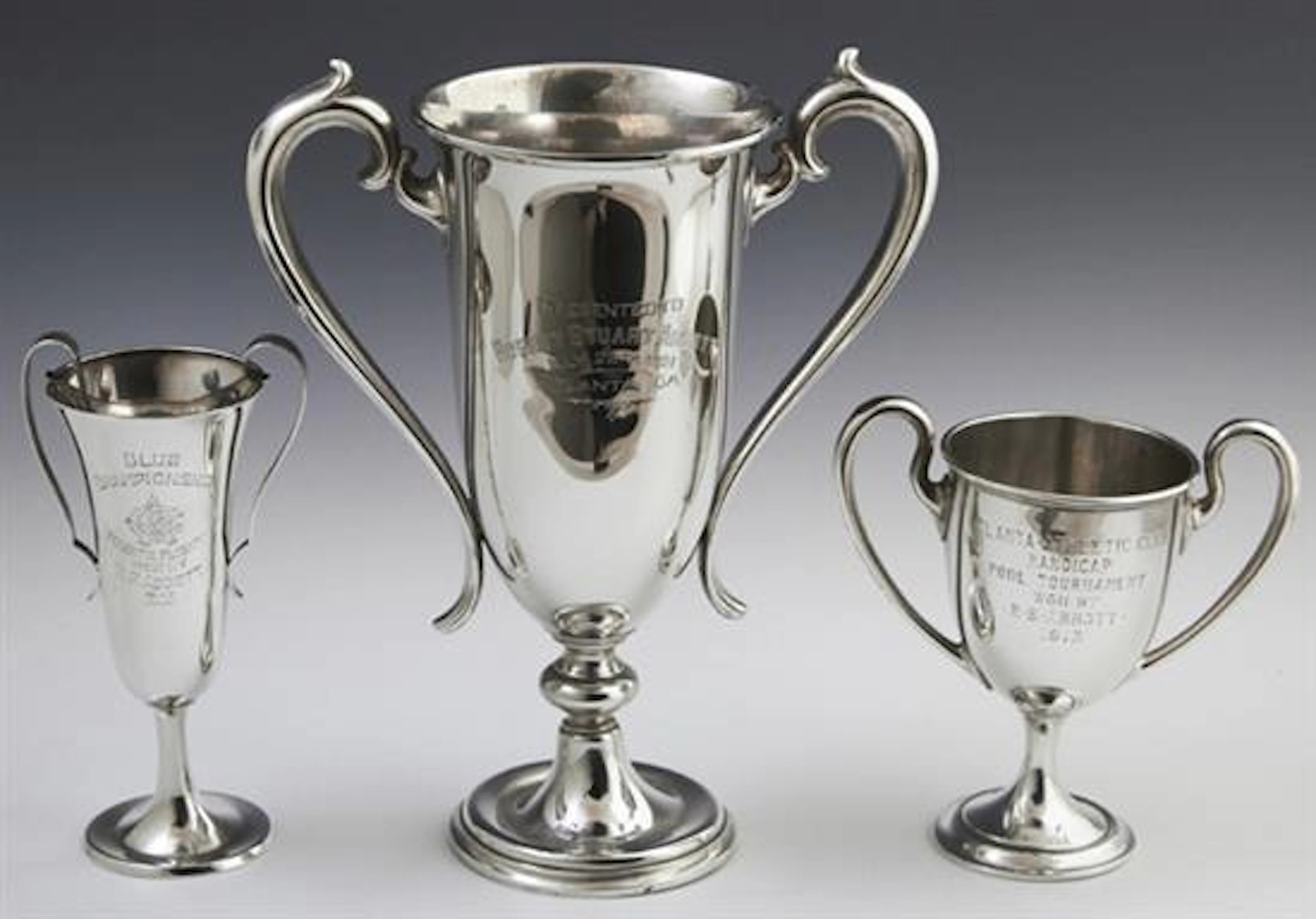 Three Sterling Trophy Loving Cups, early 20th c., consisting of a Gorham example engraved "Atlanta Athletic Club Handicap Pool Tourn...