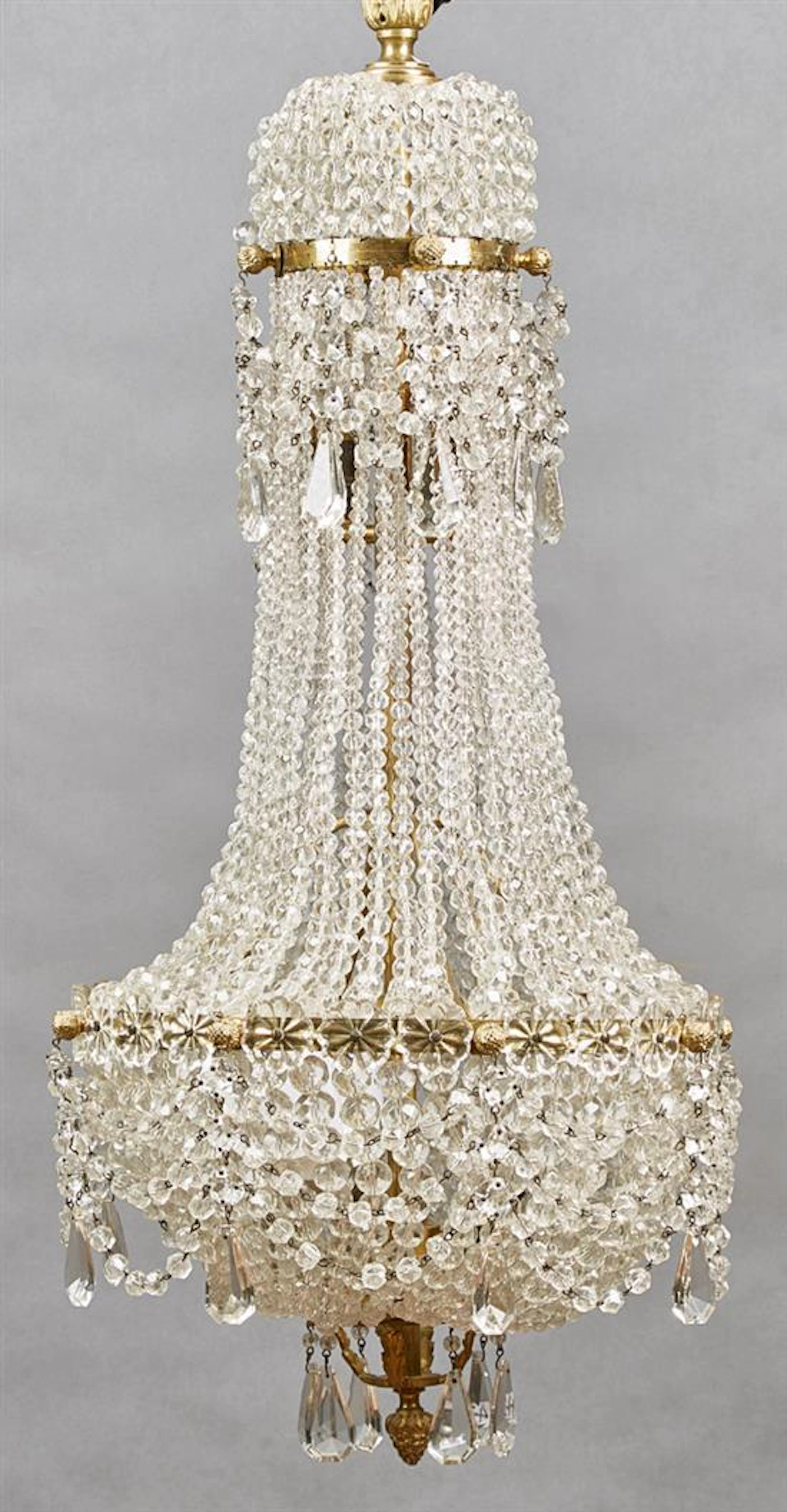 Exceptional French Empire Style Gilt Bronze and Crystal Five Light Corbeille Chandelier, 20th c., the top issuing short beaded cryst...