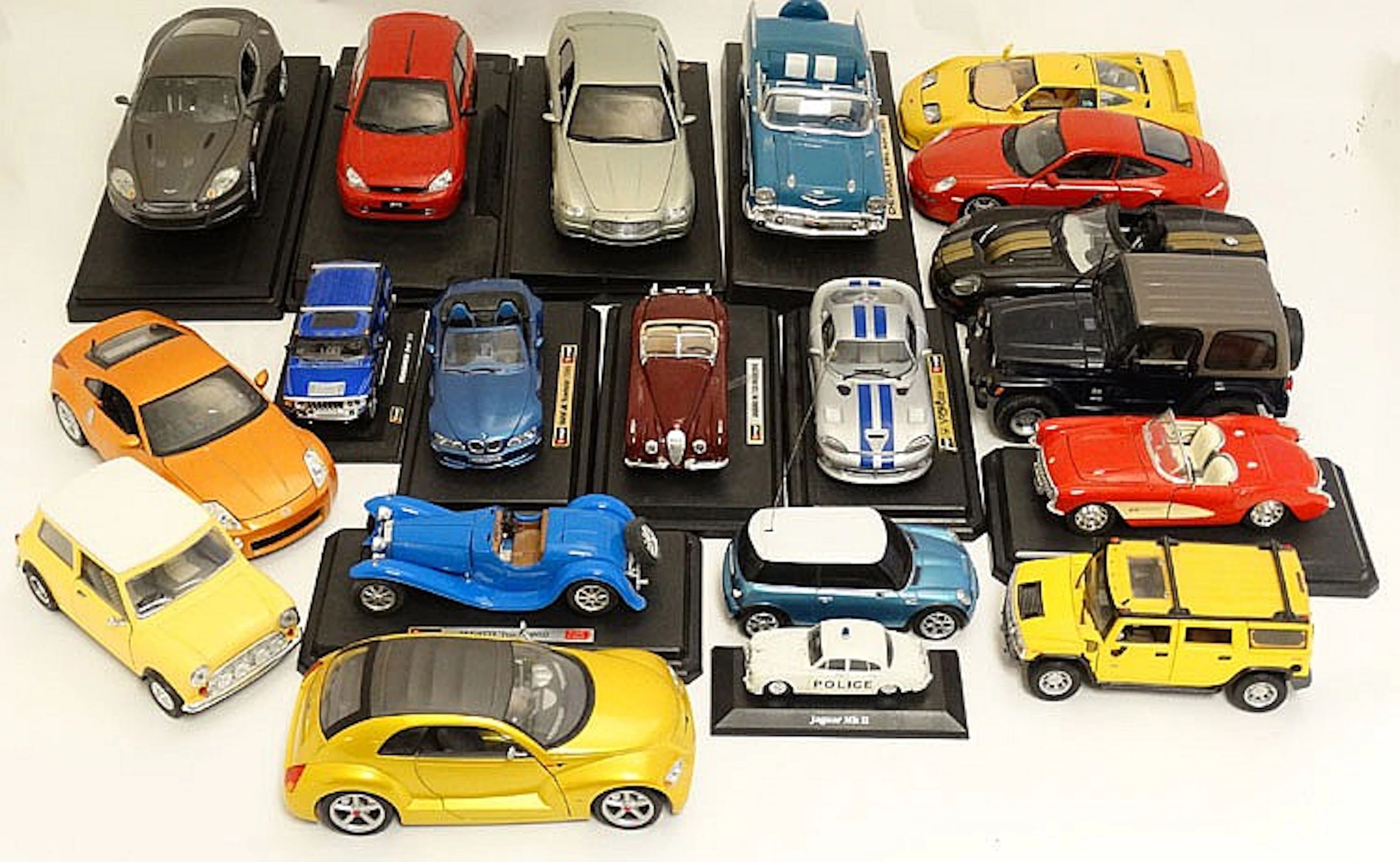 Toy: A collection of approximately 18 model cars to include a Burago BMW M