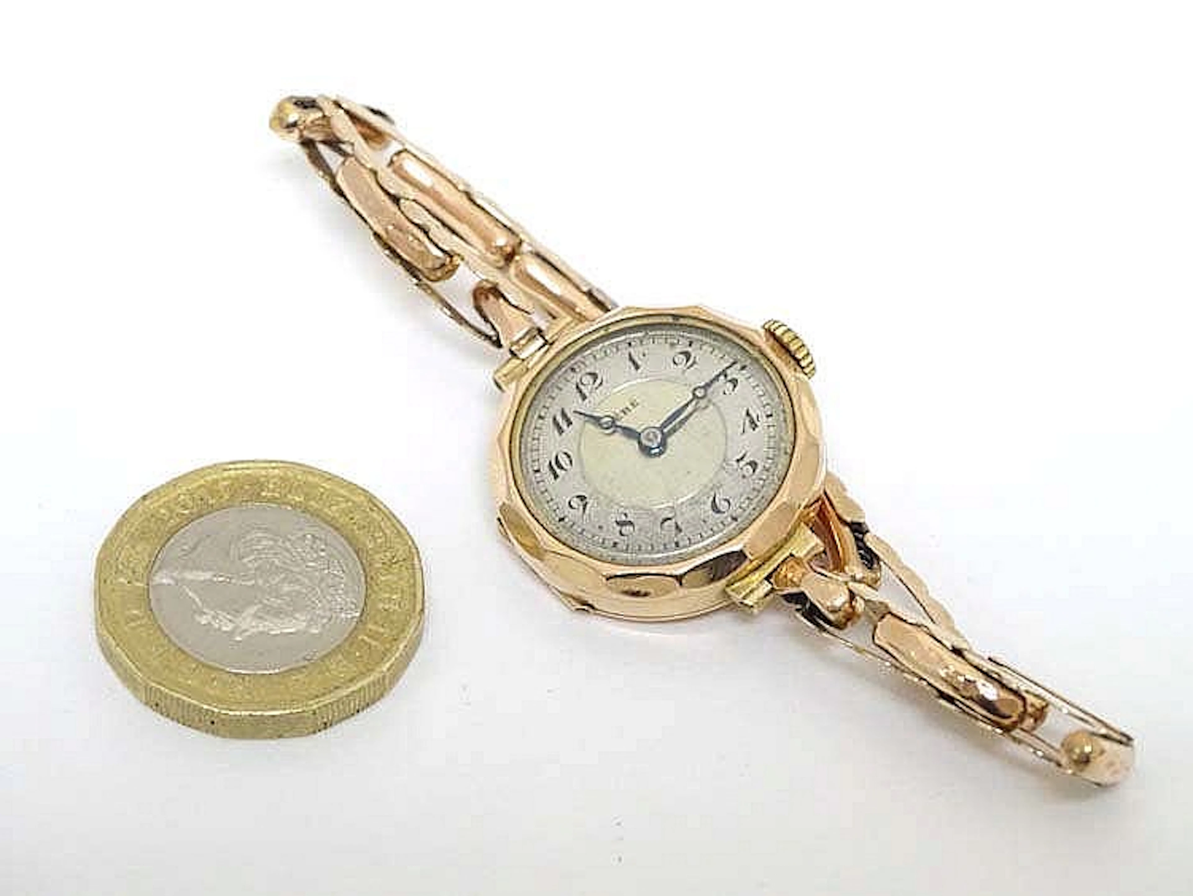 9 ct ( .375) gold Ladies cocktail watch : a Swiss made 15 Jewel mechanical