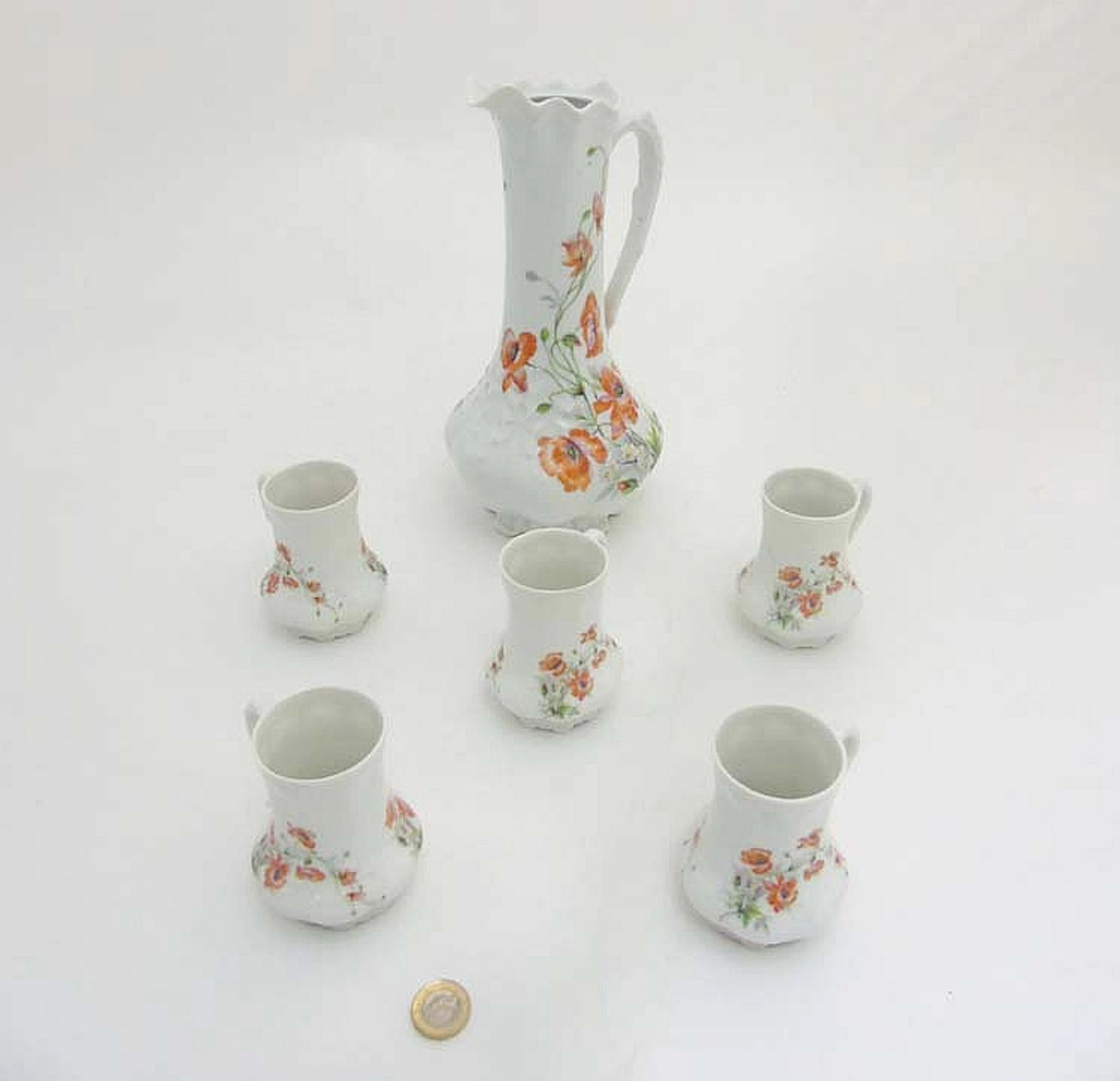 A Limoges France Giraud Belle Epoque jug together with five cups each with