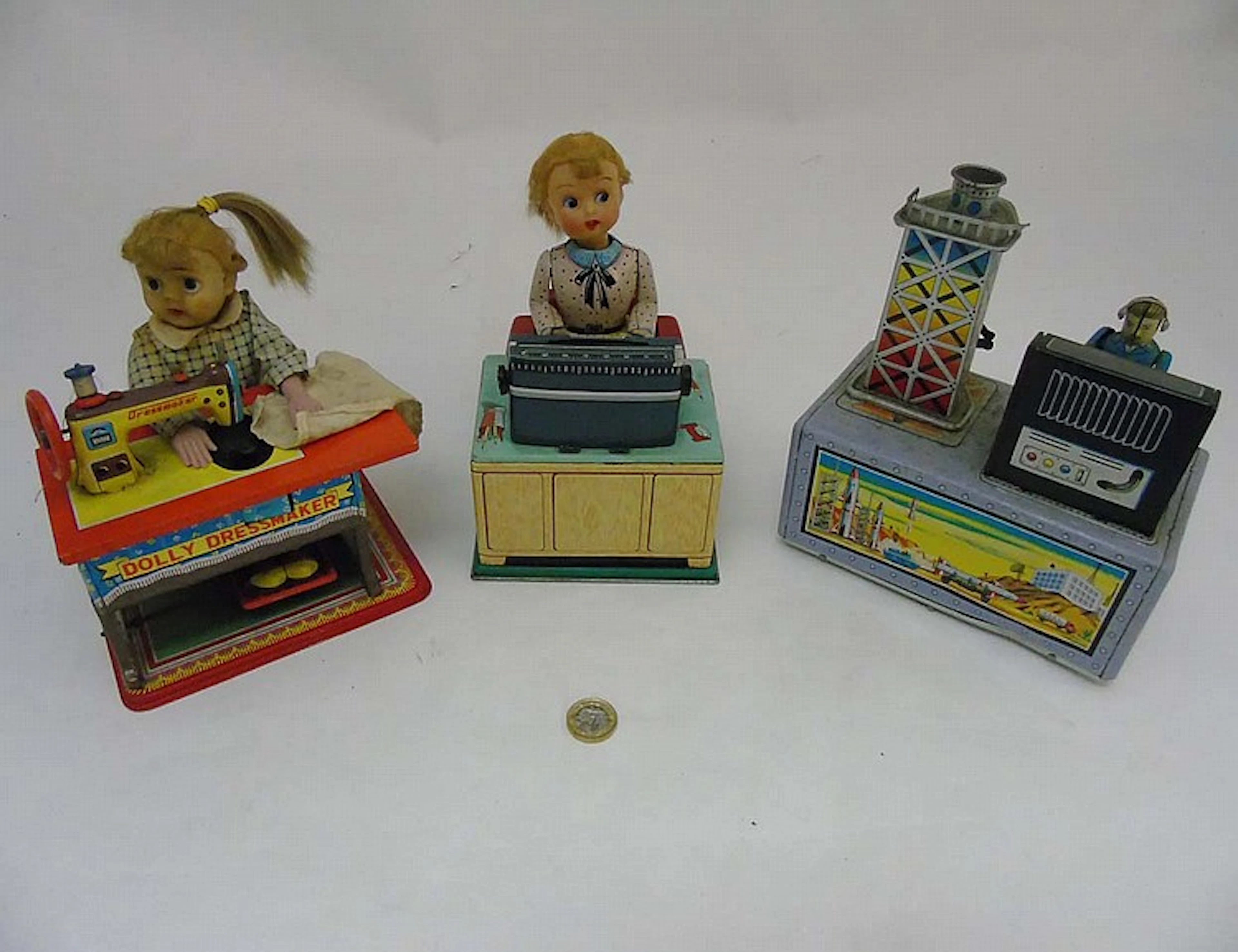 Three 1950s battery operated tin plate toys comprising a Linemar Japan ''Bu