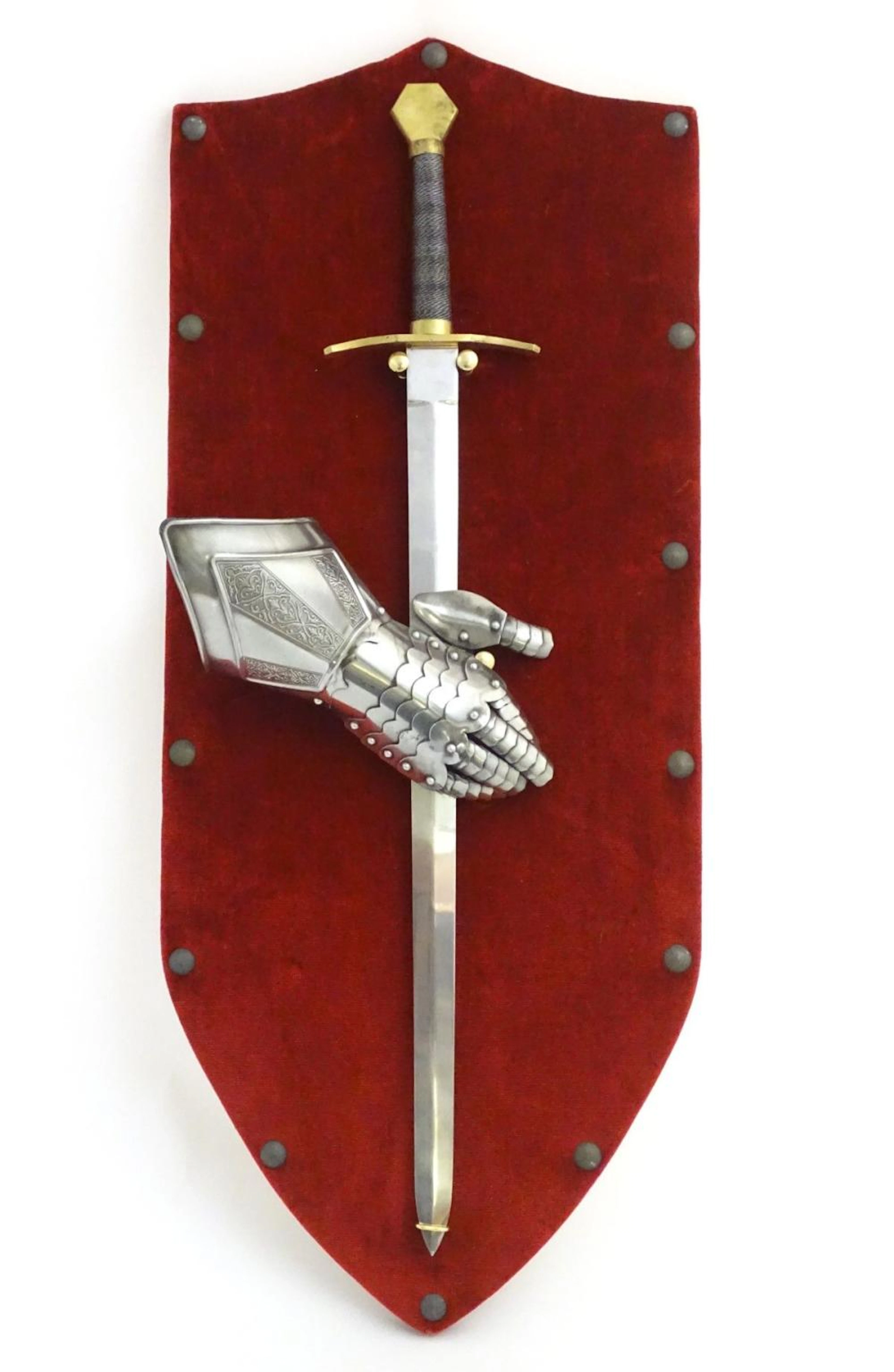 A 20thC wall display of medieval style knights' arms & armour, comprising sword and gauntlet affixed