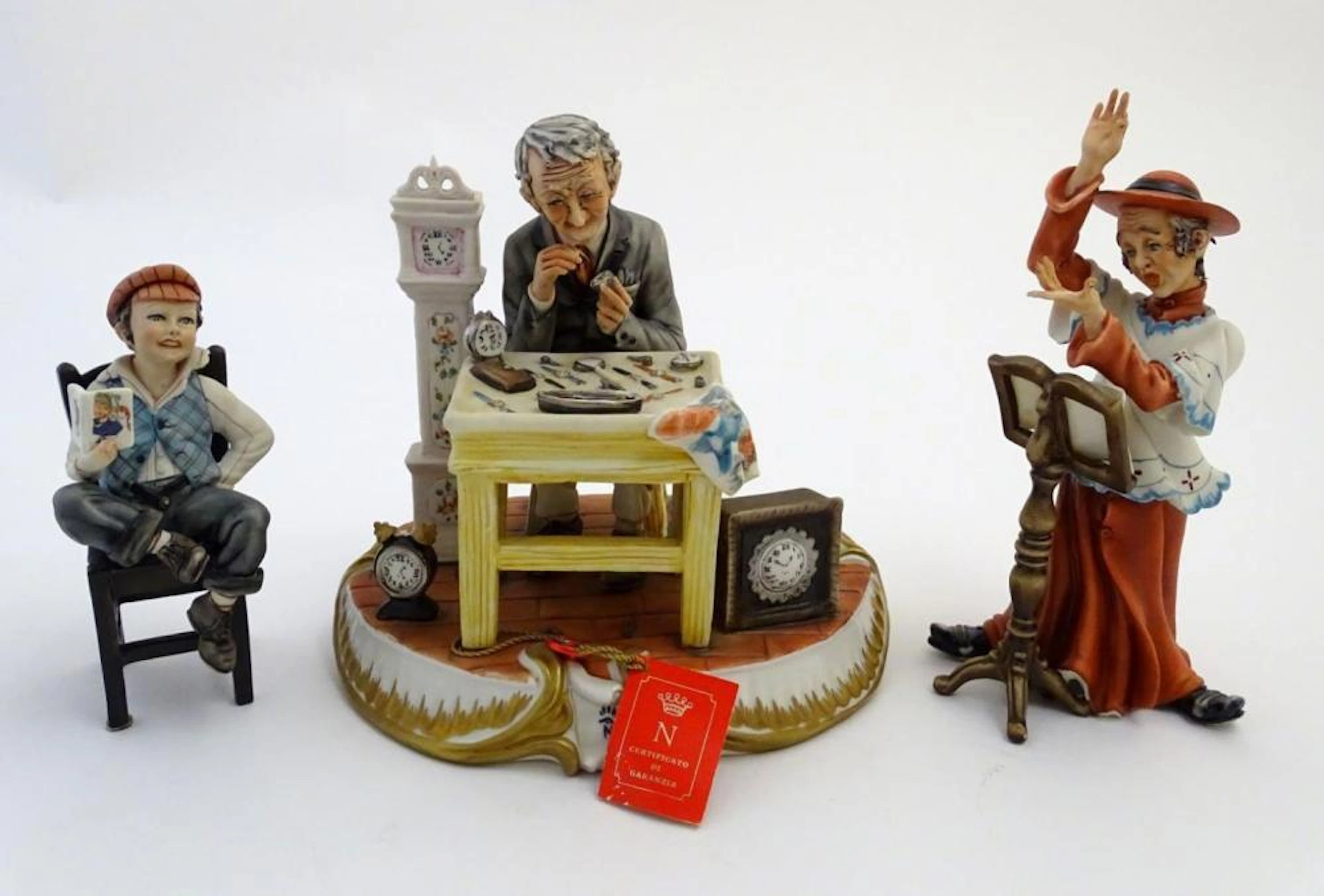 Three Italian Capodimonte figures, to include A watch / clock maker / repairer (no. 138/8), A cardin