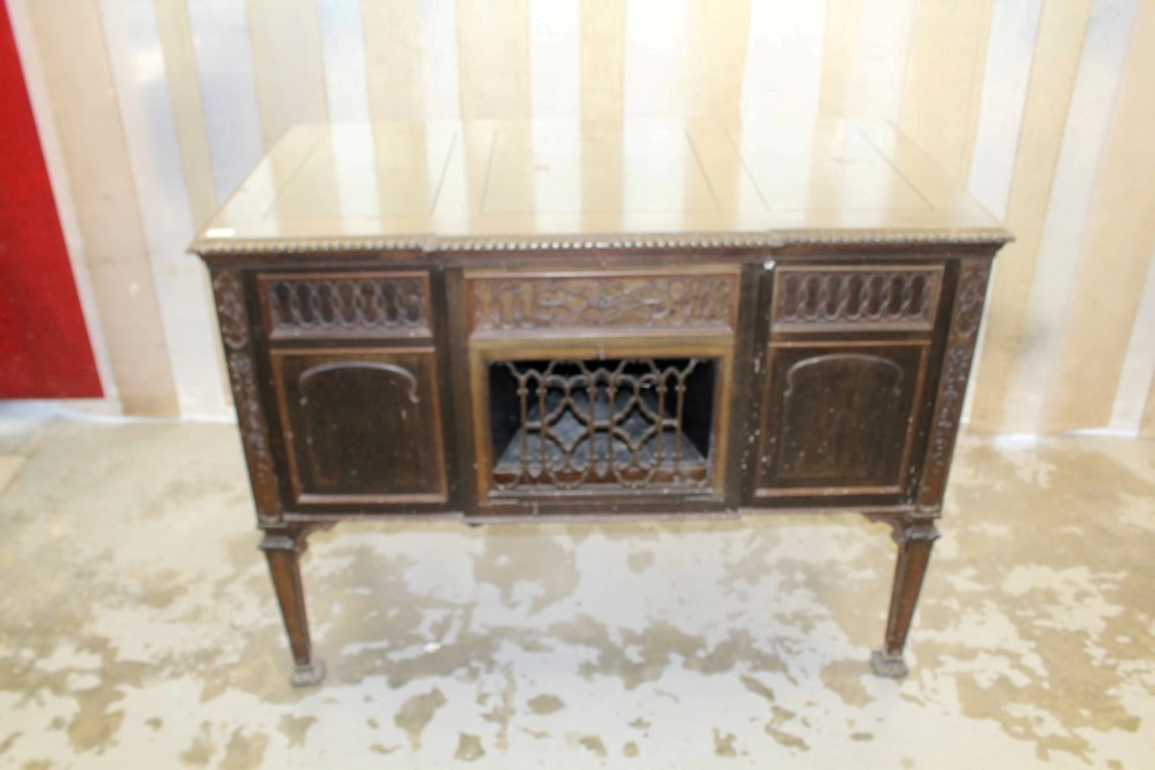Wind-up gramophone in wooden cabinet / sideboard with record sections and