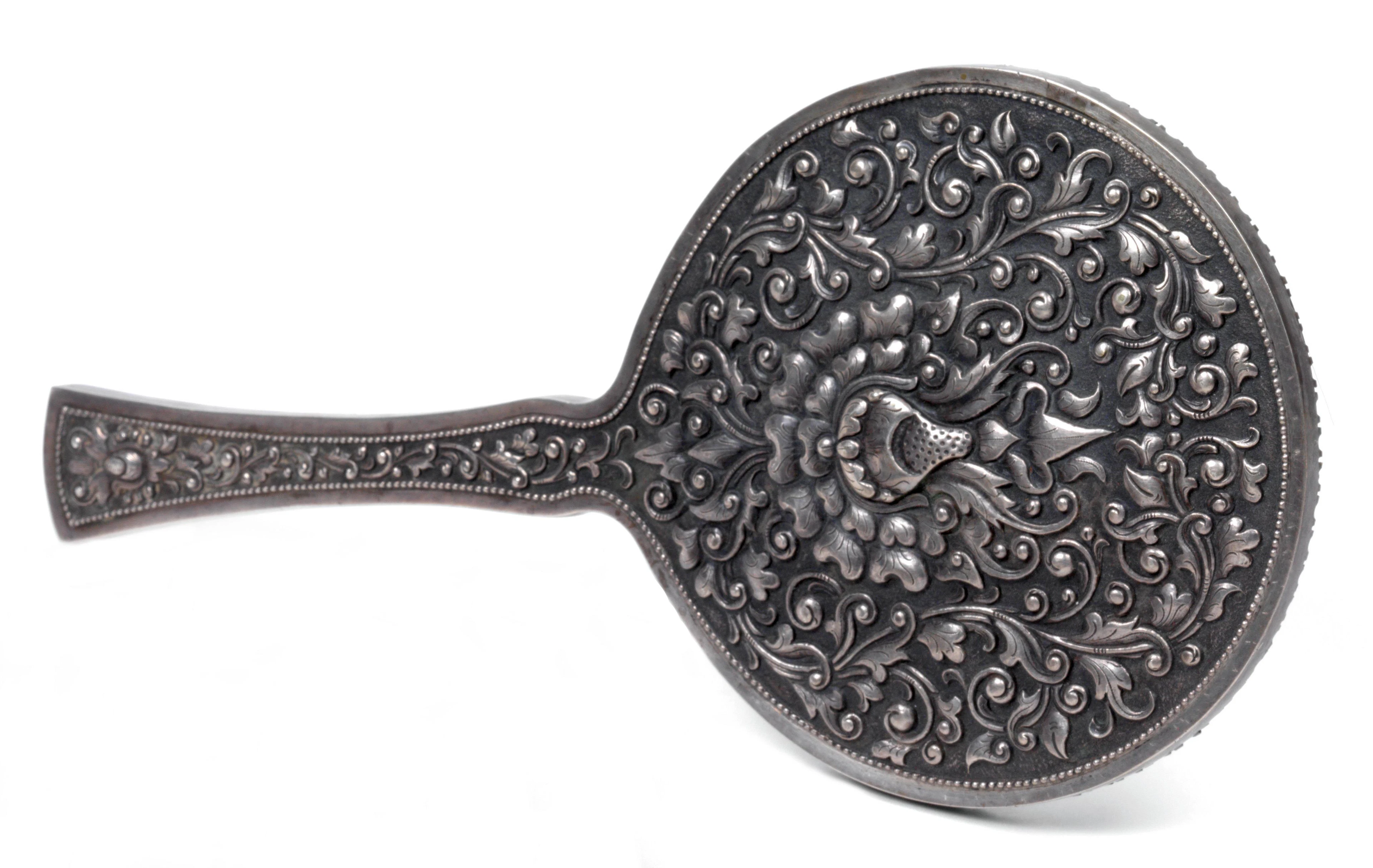 An Indonesian silver hand mirror, Yogya, Colonial Period