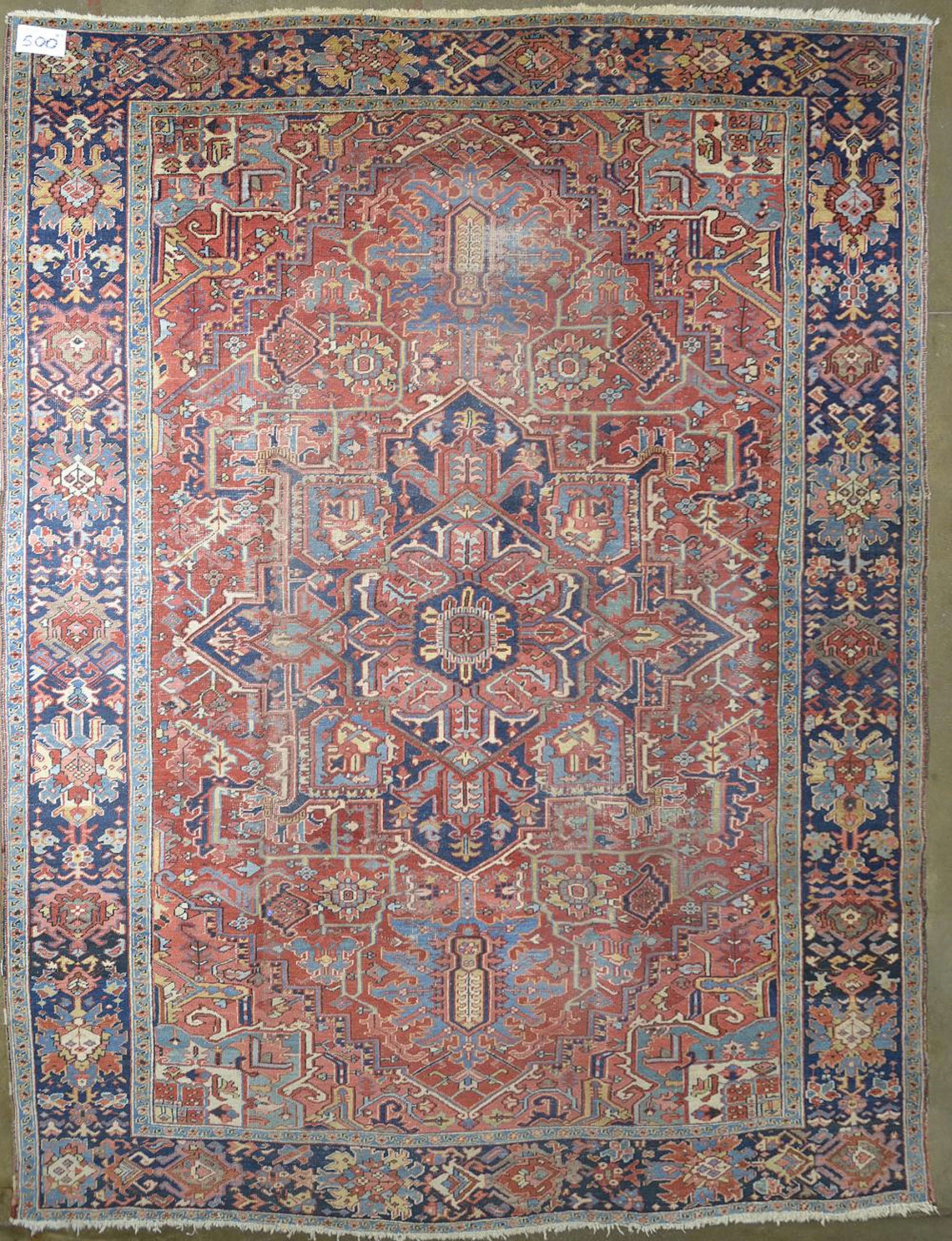Tapis Grand tapis Heriz en laine au décor floral sur fond rouge