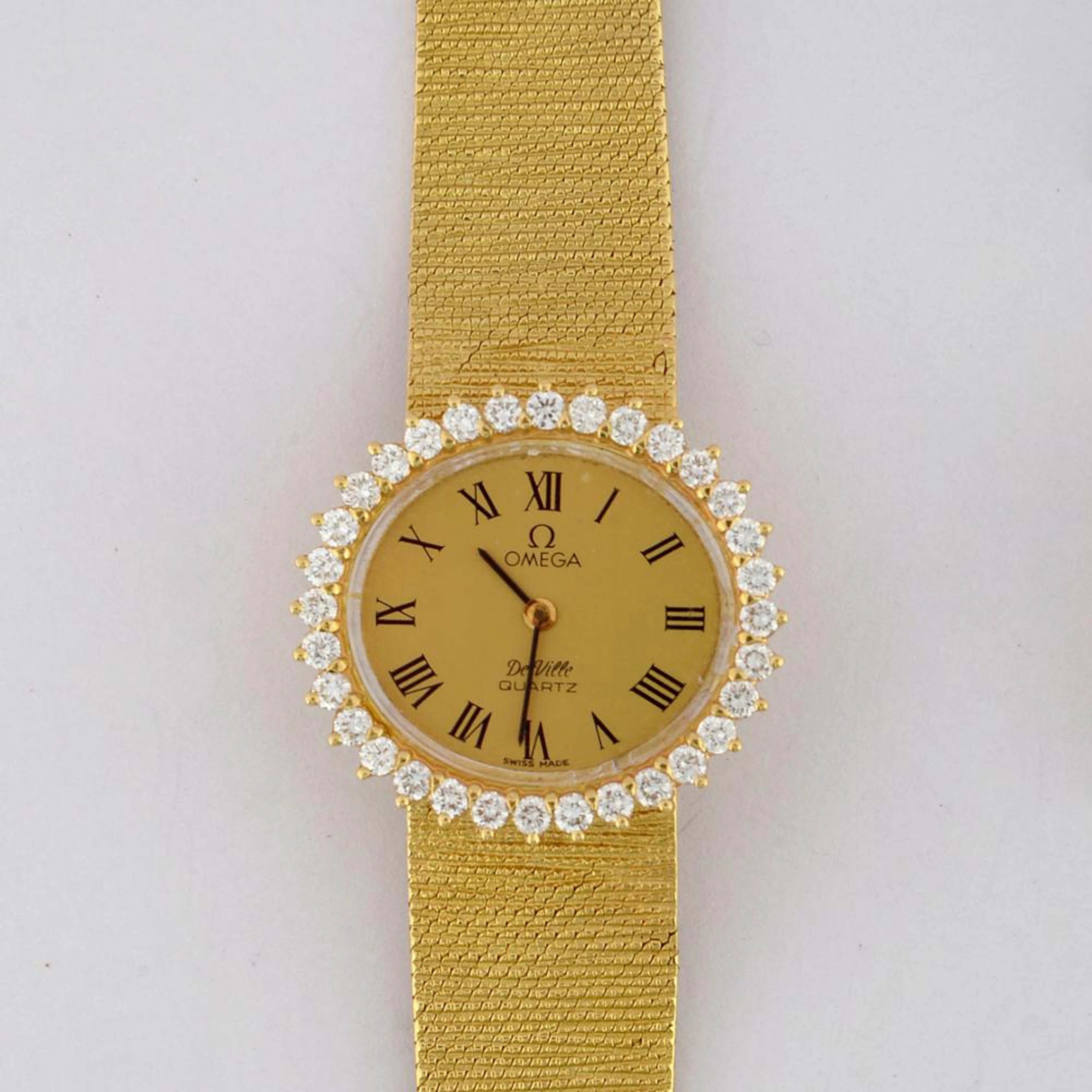 Horlogerie Montre en complet or jaune 18 carats de marque Oméga sert