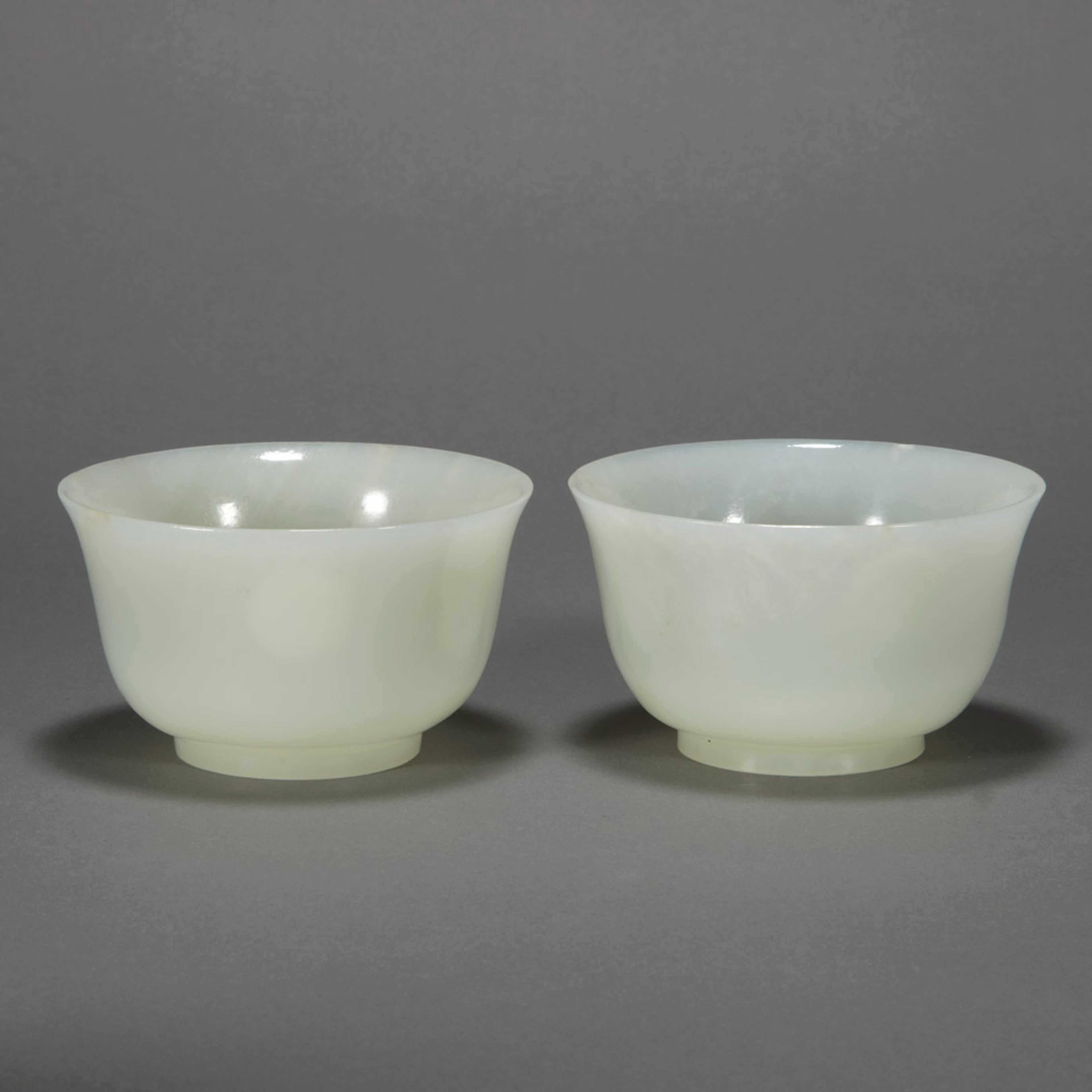 Group of Three Chinese Jade Bowls; Together with a Dark Green Hardstone Shallow Bowl