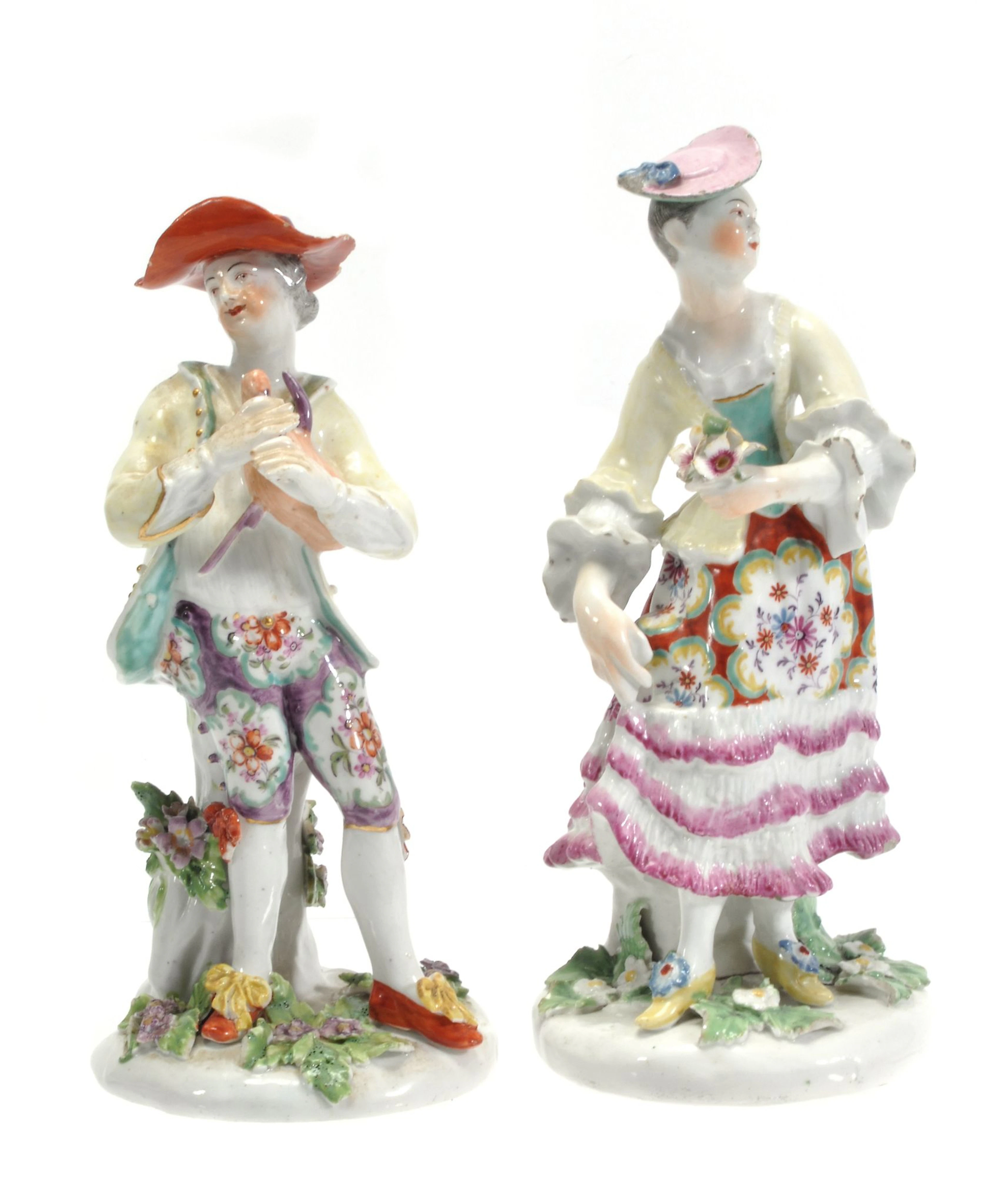 A pair of Derby figures of a bagpiper and a dancer