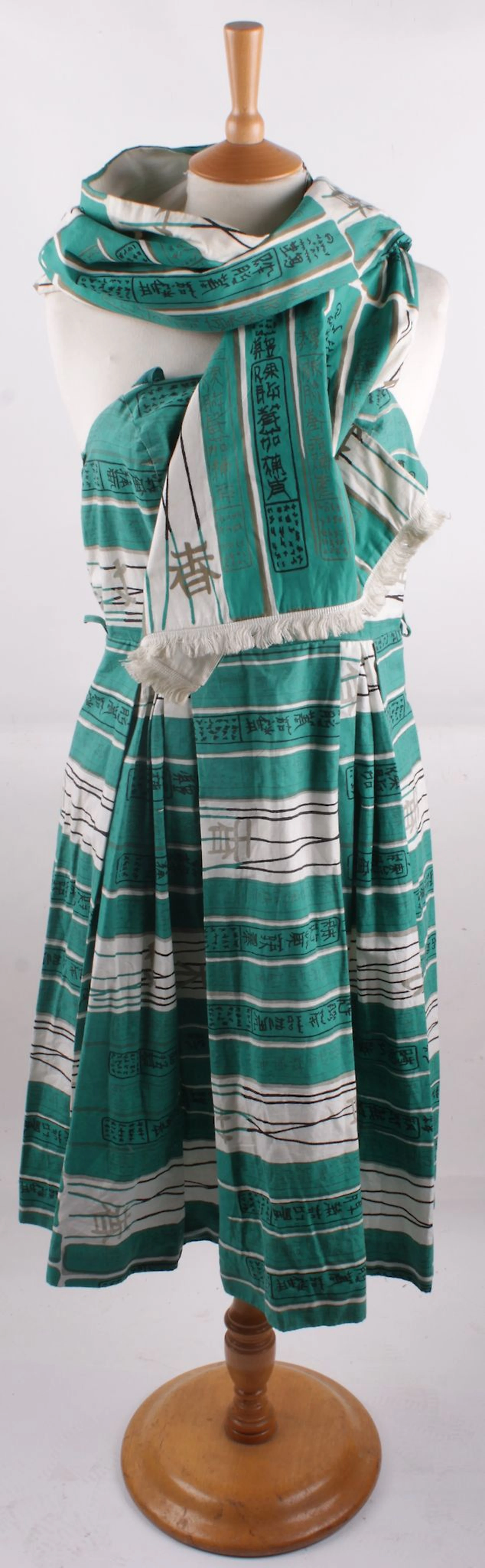A 1950s cotton print dress with matching stole