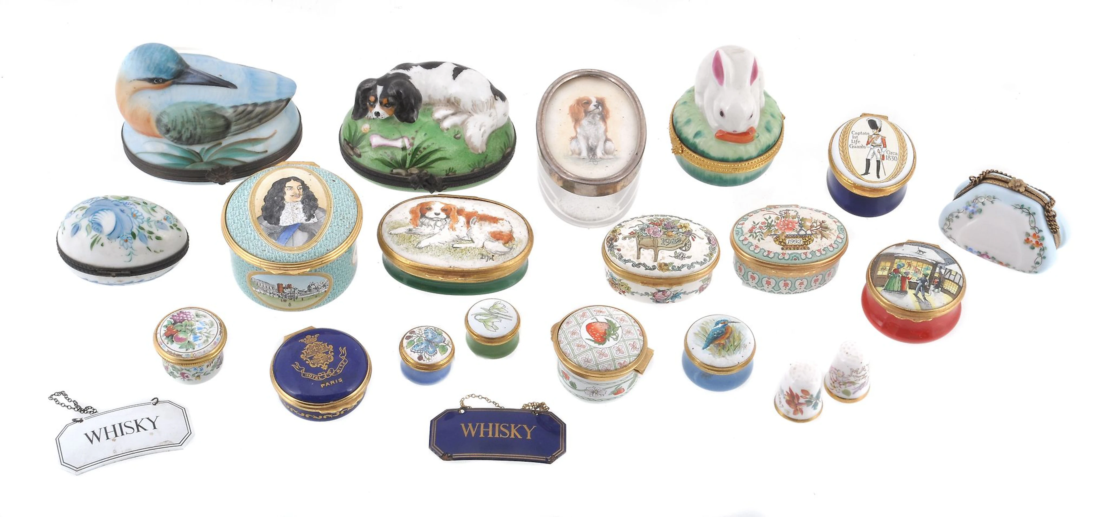 A collection of various pill boxes, including