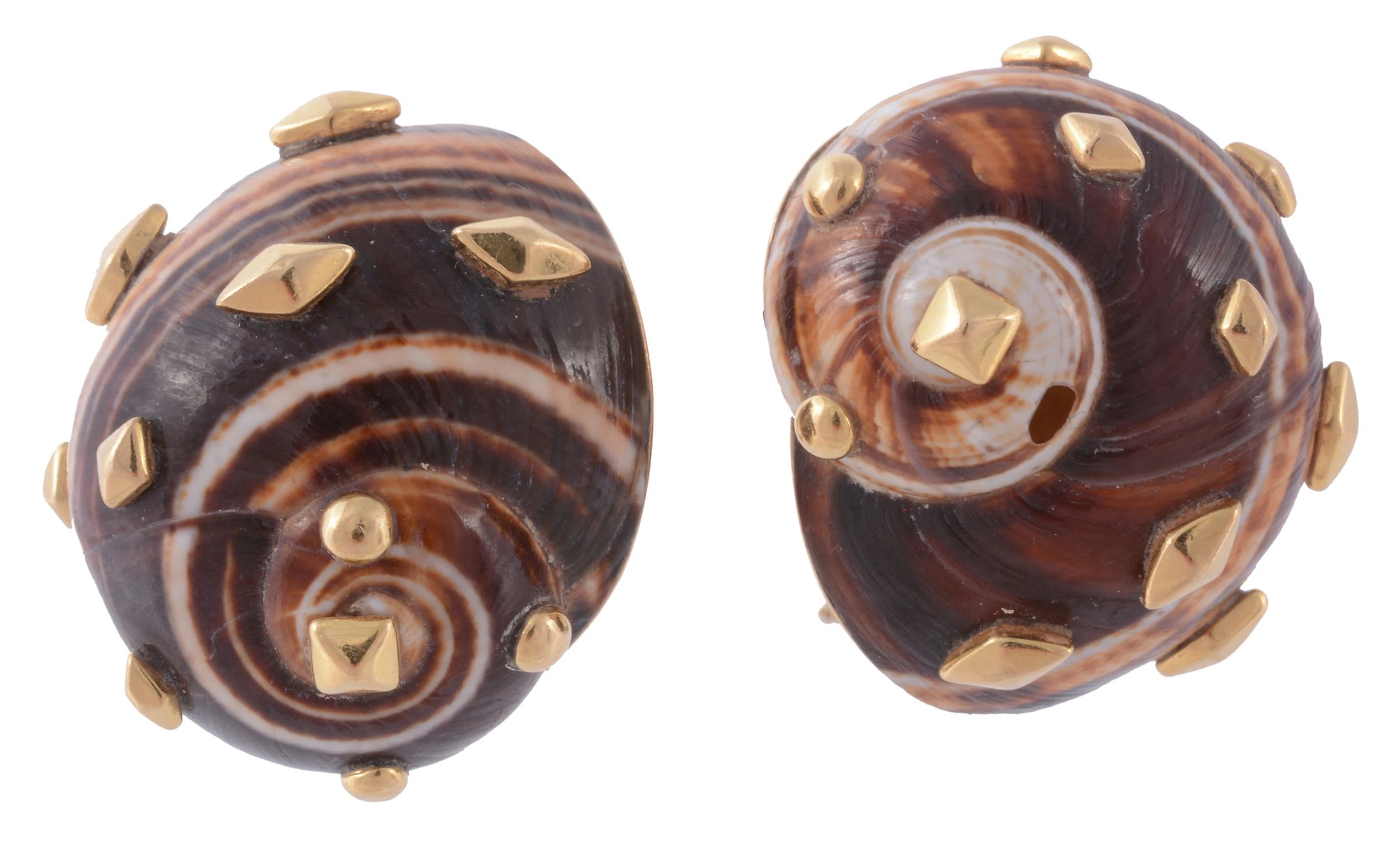A pair of natural shell ear clips by Trianon