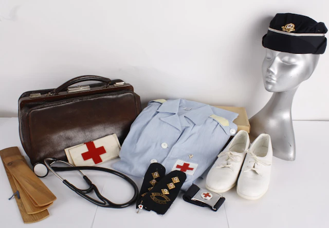 A collection of medical uniforms and equipment, including