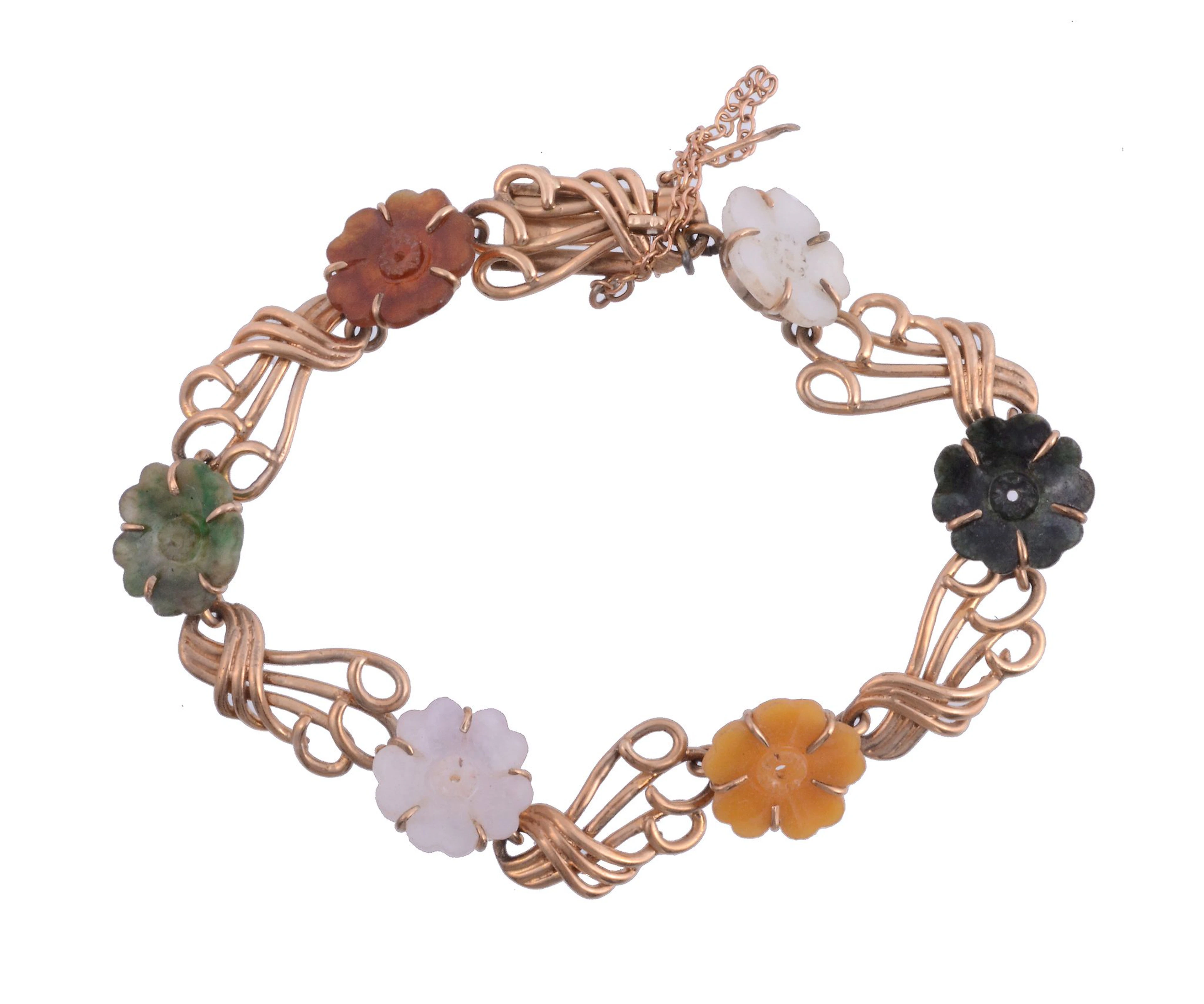 A hardstone flower bracelet, circa 1950, composed of vari coloured jade...