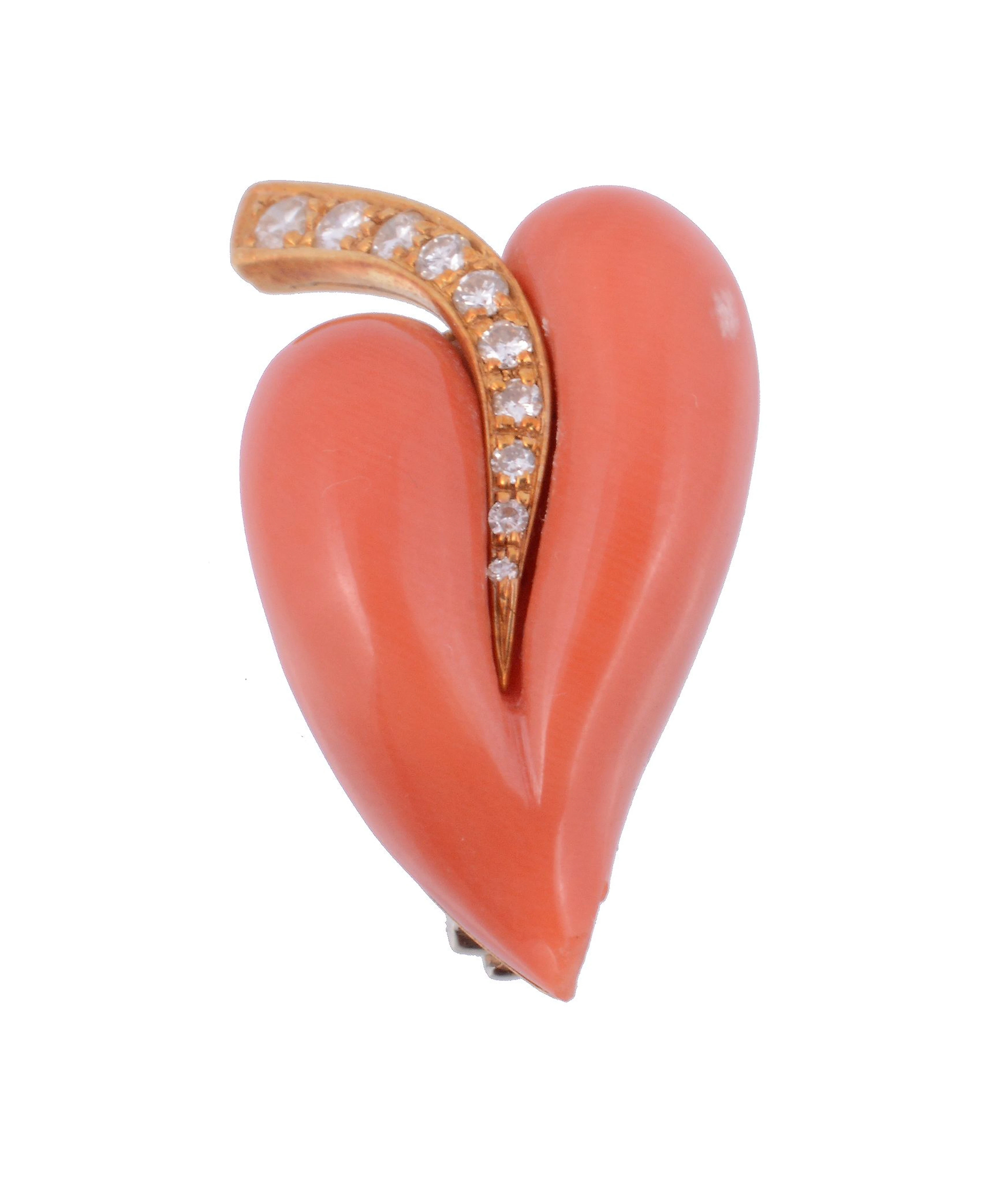 A diamond and coral leaf brooch , the polished coral leaf with a graduated...