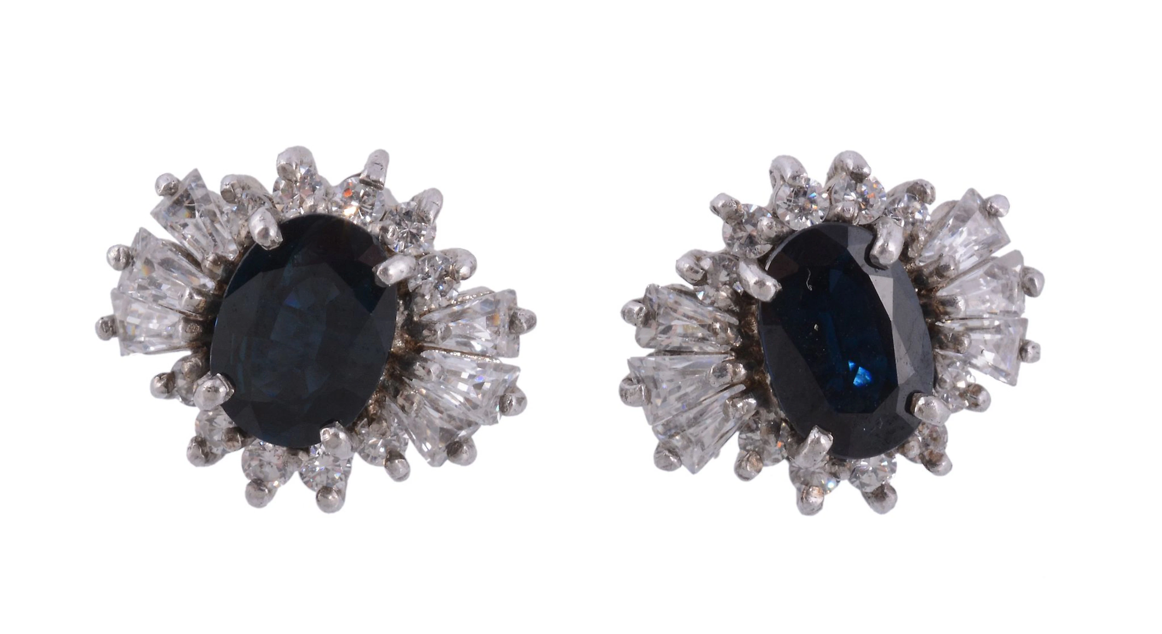 A pair of sapphire and white stone ear studs