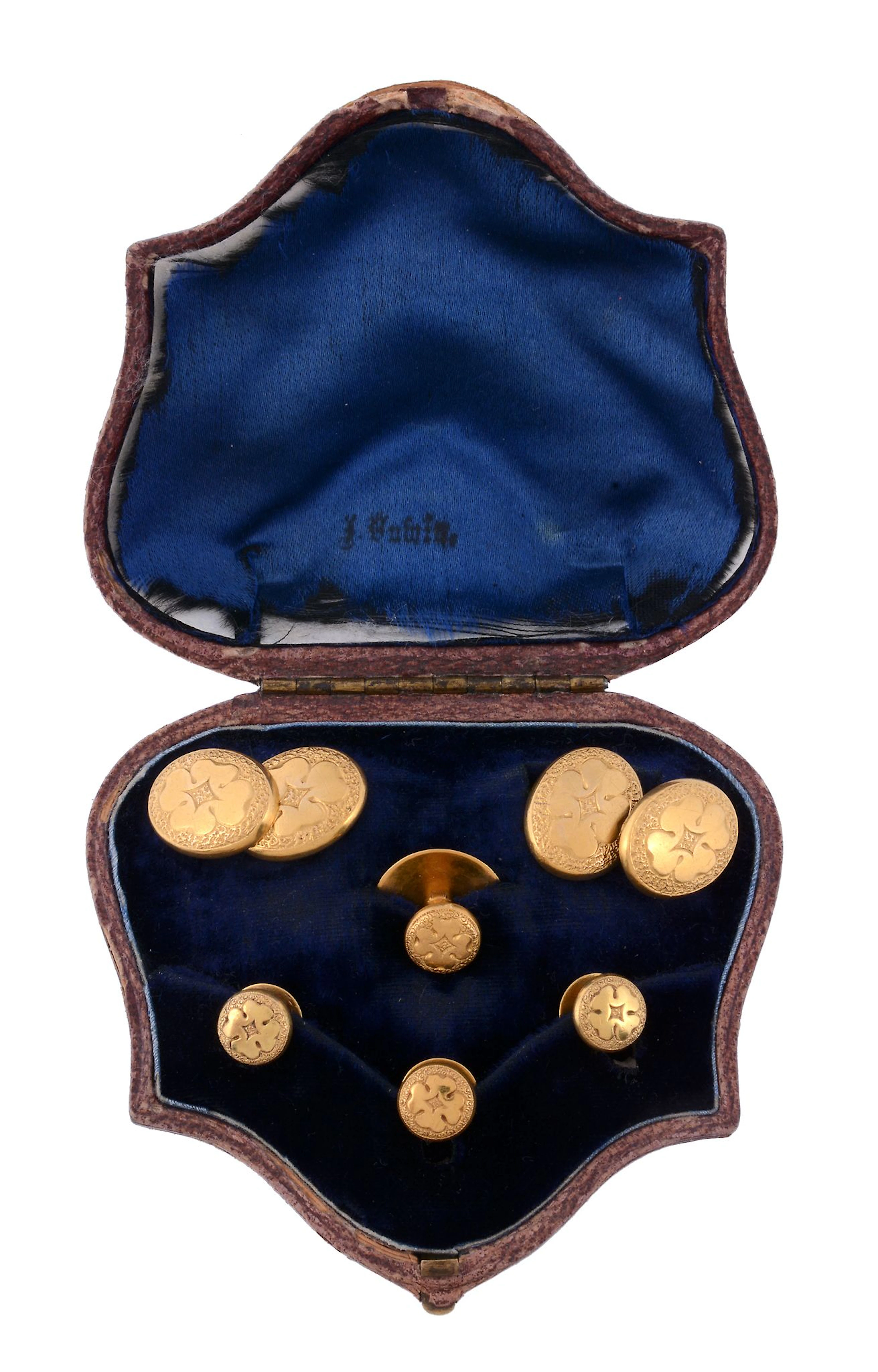 A pair of gold coloured double sided cufflinks