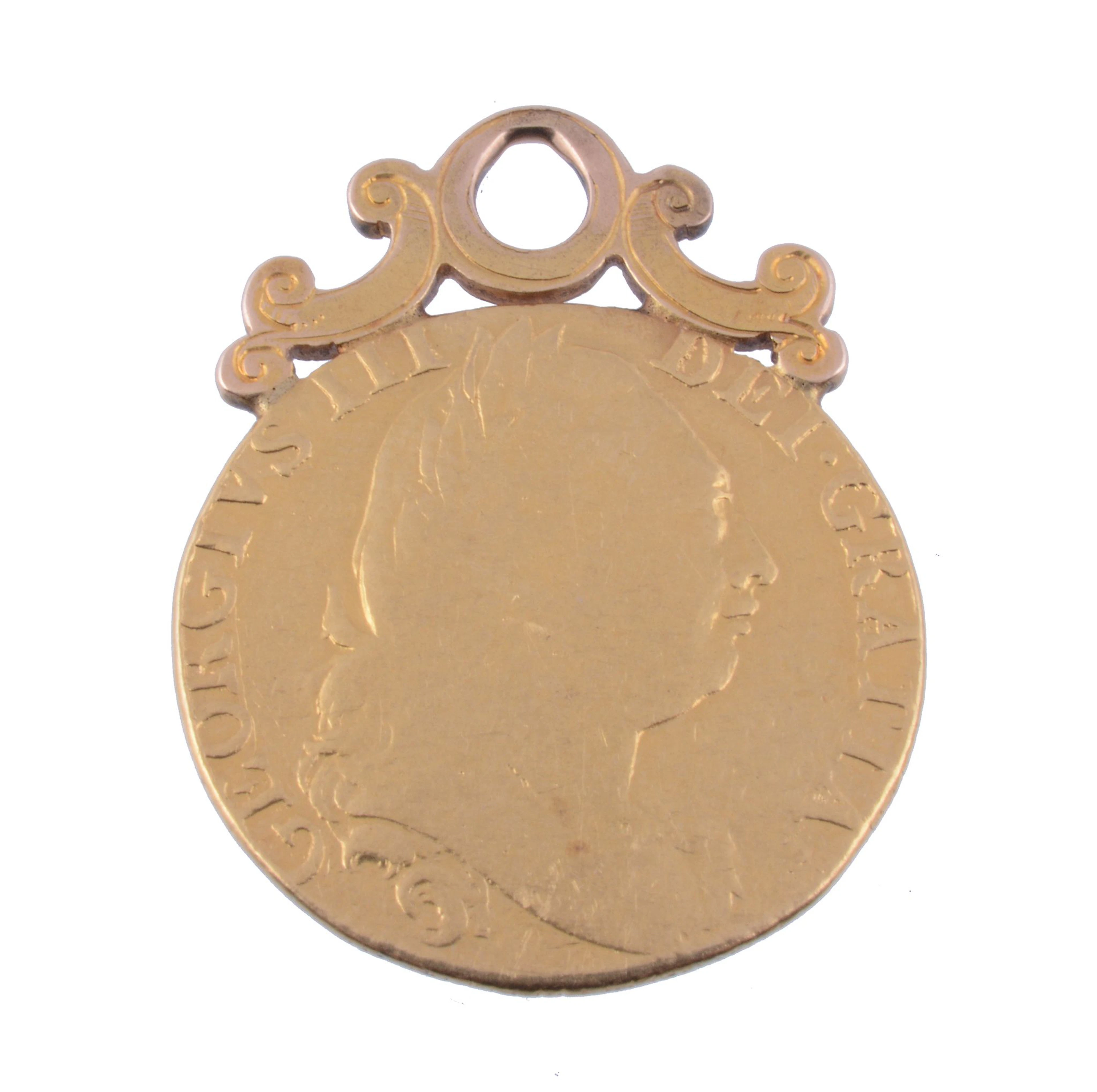 A George III Guinea pendant, dated 1777, with soldered scrolled pendant setting