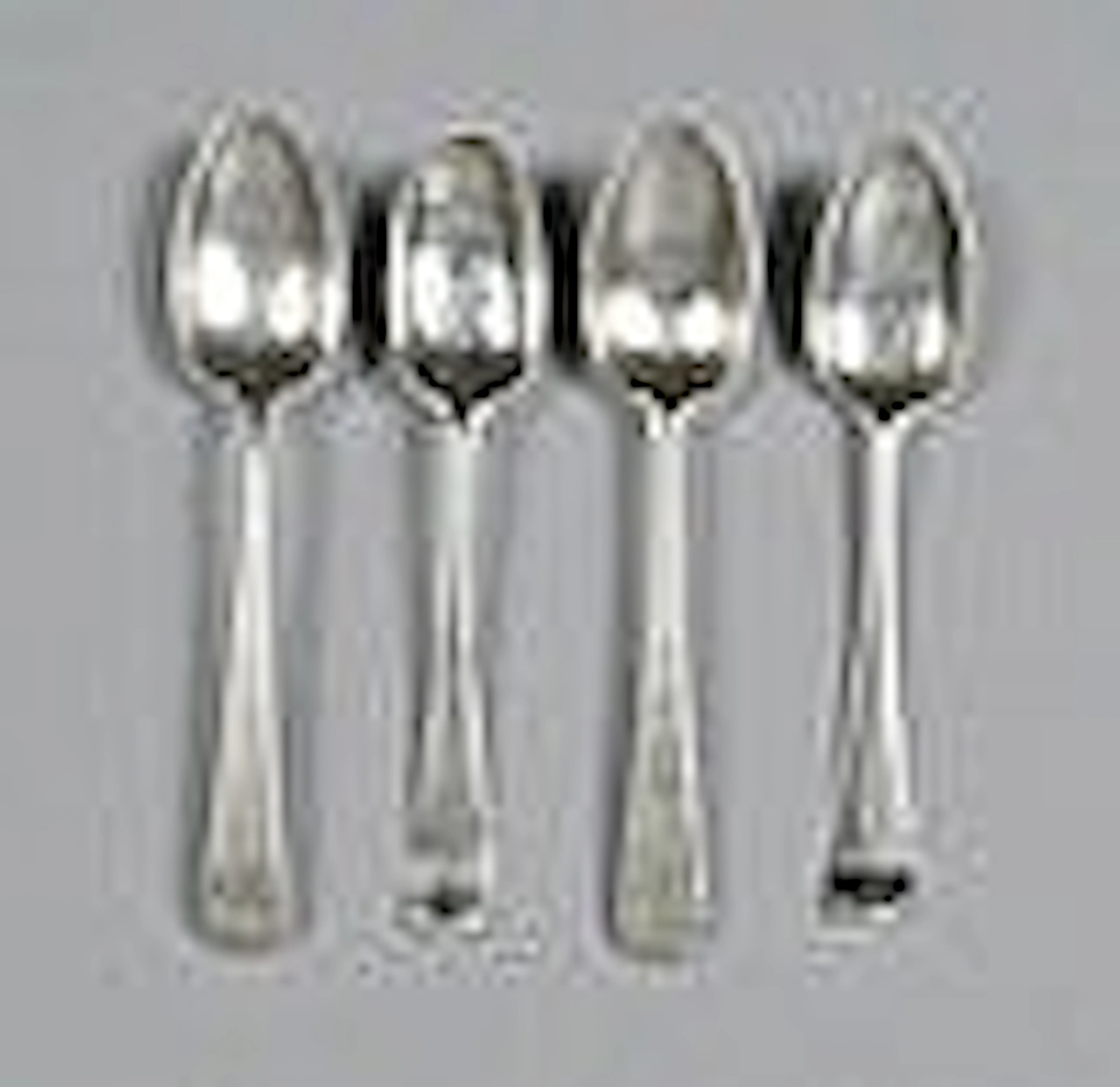 Four late Georgian picture back tea spoons, mixed