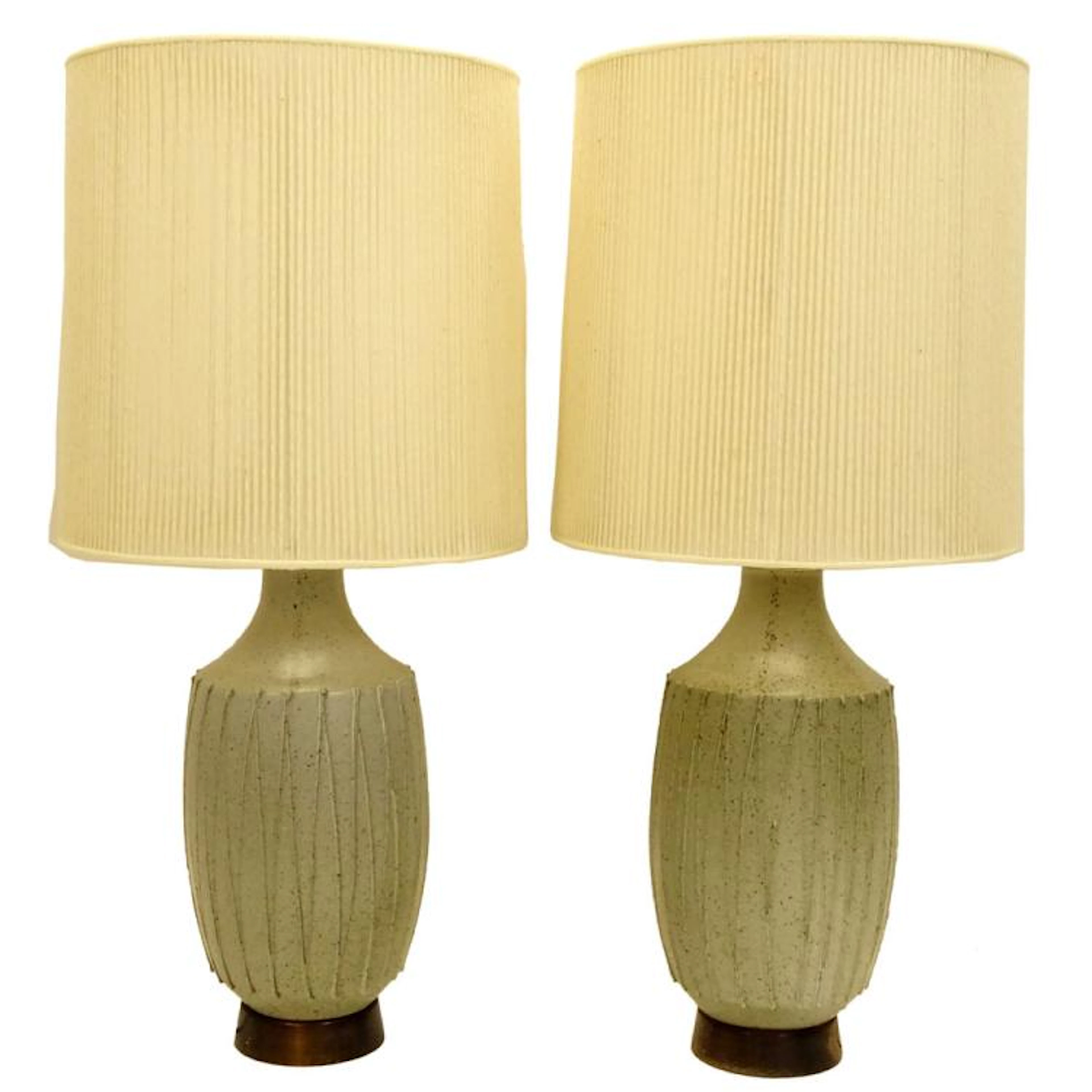 Pair of Mid Century Modern Japanese Style Speckled Glaze Pottery Lamps With Corded Shades. Unsigned. Good condition. Measures 32" H to finial x 9" W, shades measures 16" H x 15"dia