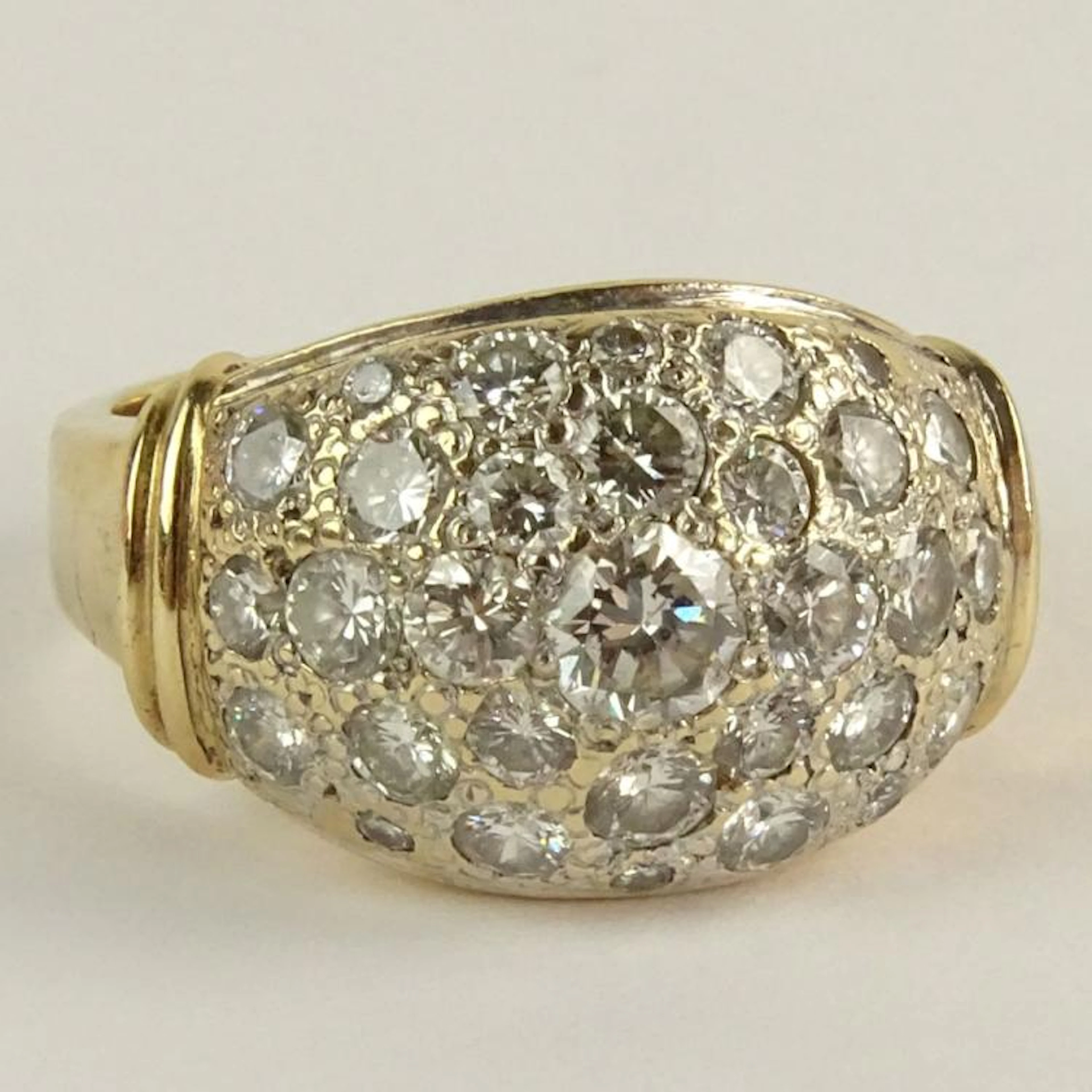 Lady's Pave Set Round Brilliant Cut Diamond and 14 Karat yellow Gold Ring. Diamonds G-H color, SI1 clarity. Signed 14K. Very good condition. Ring size 6-1/2. Approx. weight: 5.35 pennyweights