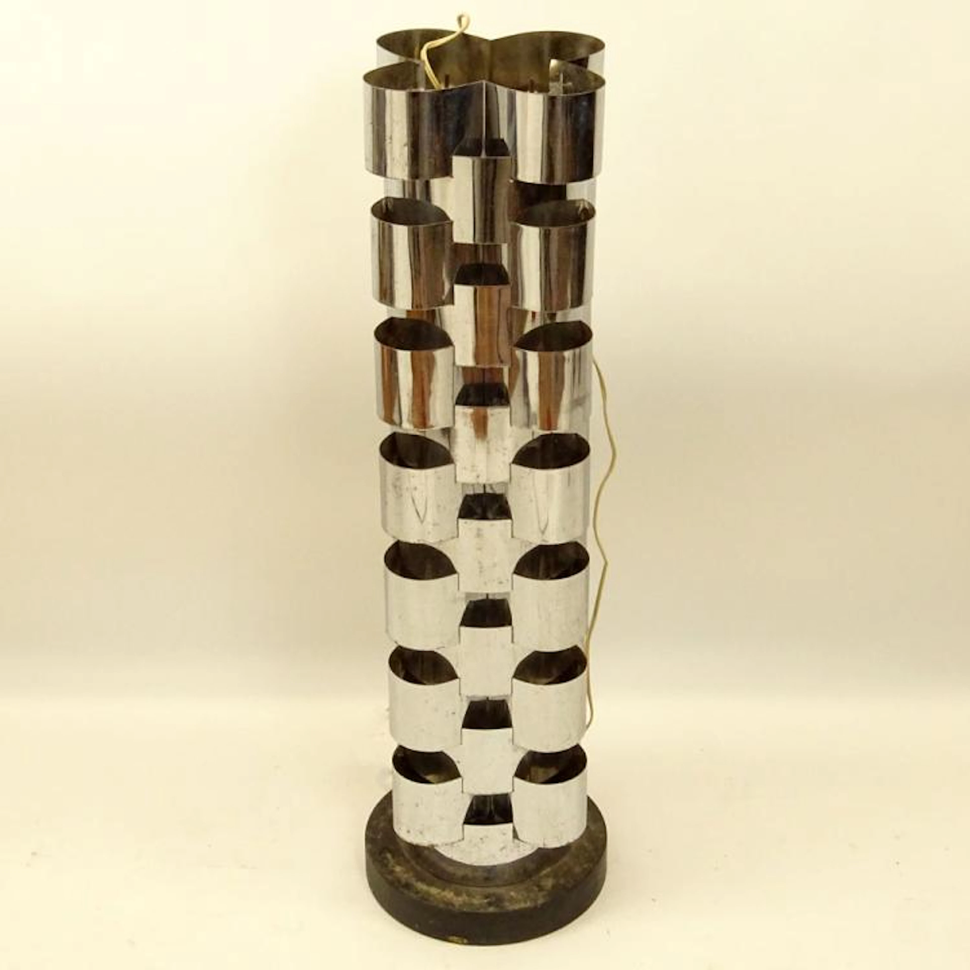 Curtis Jeré, American (20th C) Chromed metal and ebonized wood tall floor lamp. Signed. Pitting,bends and wear from age and use. Measures 61-3/4" H.