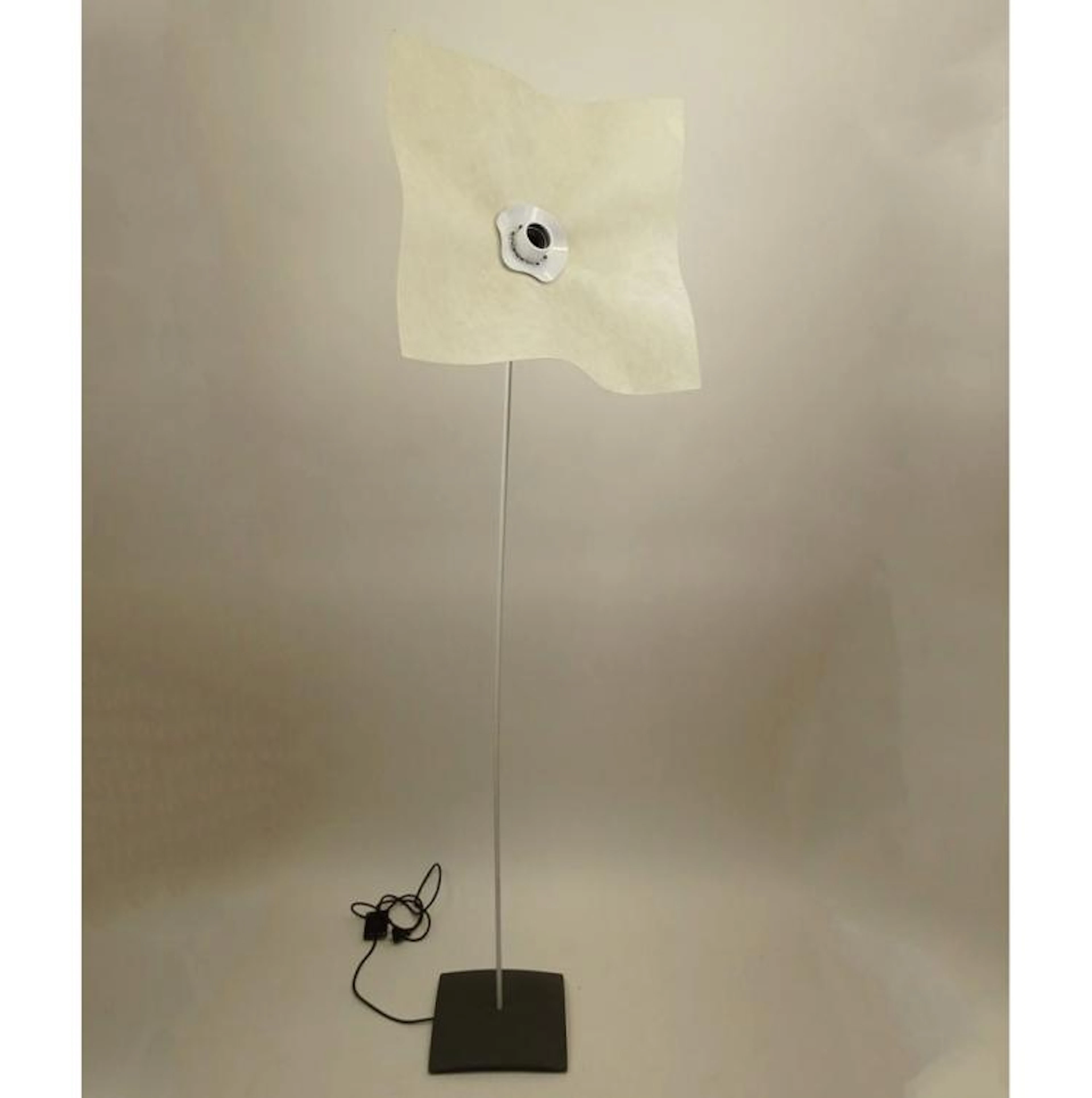1970's Vintage Mario Bellini "Area" Floor Lamp. Consists of a powder coated gray metal base, with a white powder coated stem rod and a handkerchief shaped parchment paper shade. Unsigned. Good Conditi