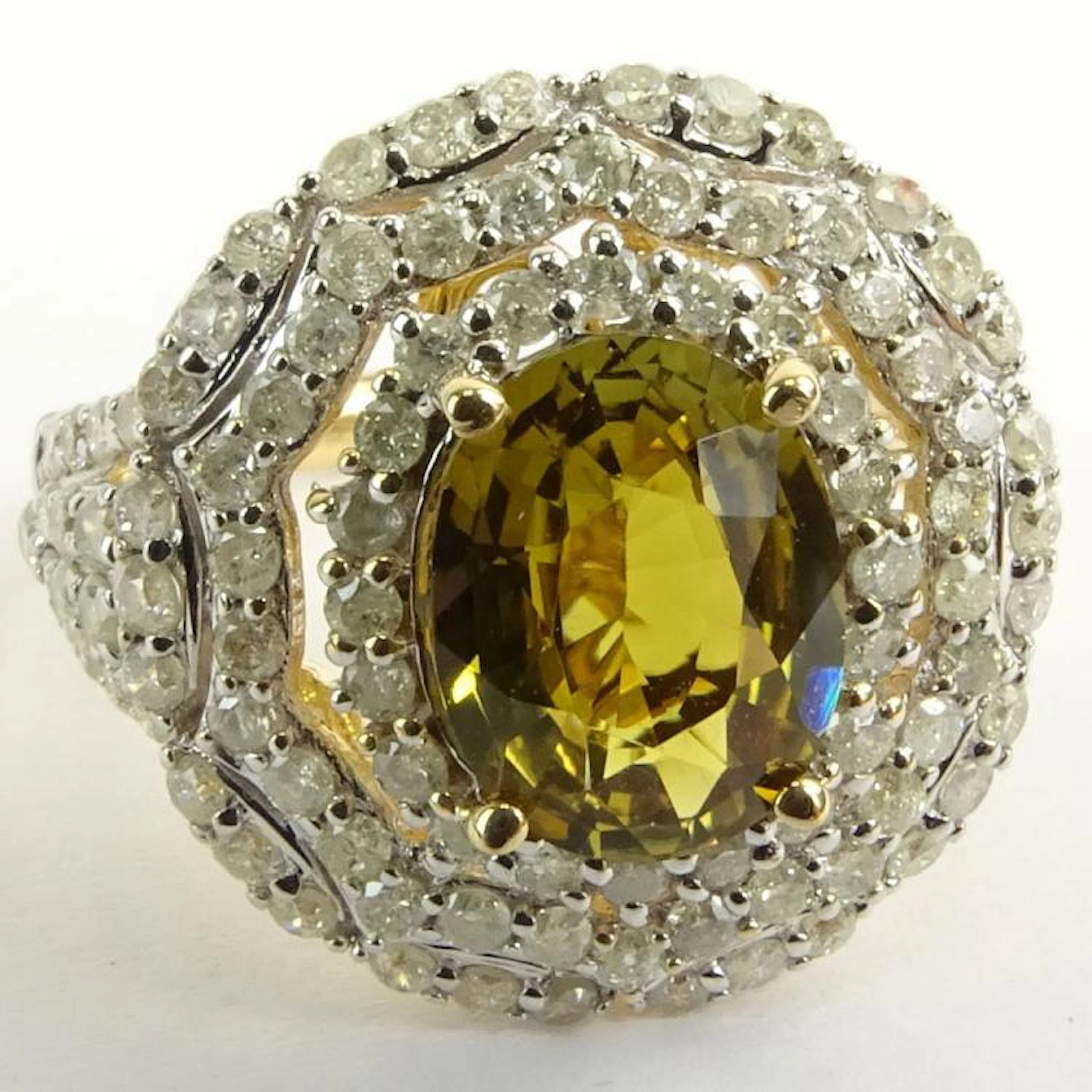 Rare GIA and AIG Certified 2.27 Carat Oval Cut Natural Alexandrite and 14 Karat White Gold Ring Accented with 1.39 Carat Round Brilliant Cut Diamonds. Alexandrite is greenish yellow changing to yellow
