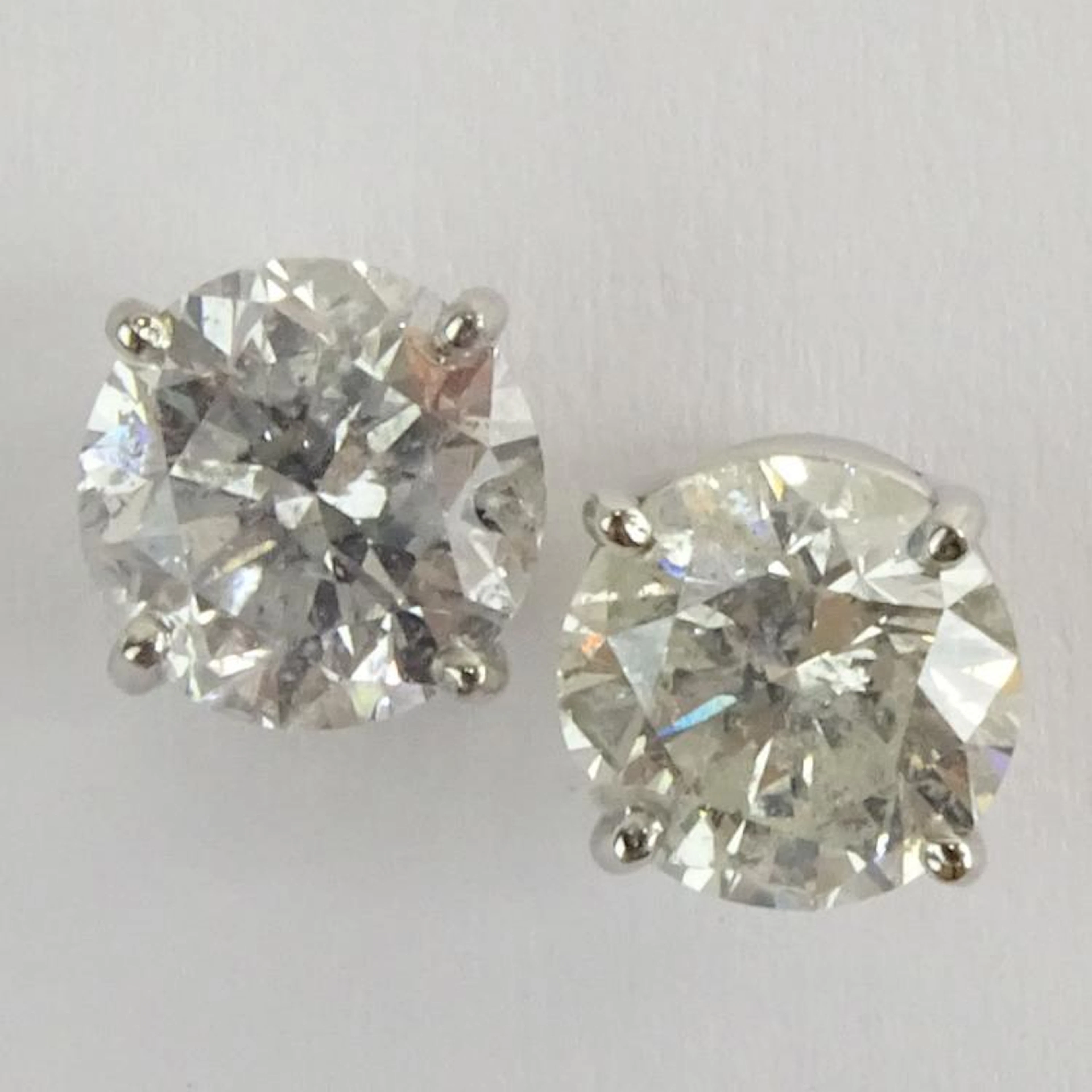 AIG Certified 2.47 Carat, total weight, Round Brilliant Cut Diamond and 14 Karat White Gold Earstuds. Diamonds F, H color, I2 clarity. Very good condition. AIG Report 000715342081 dated 12/8/15 to acc