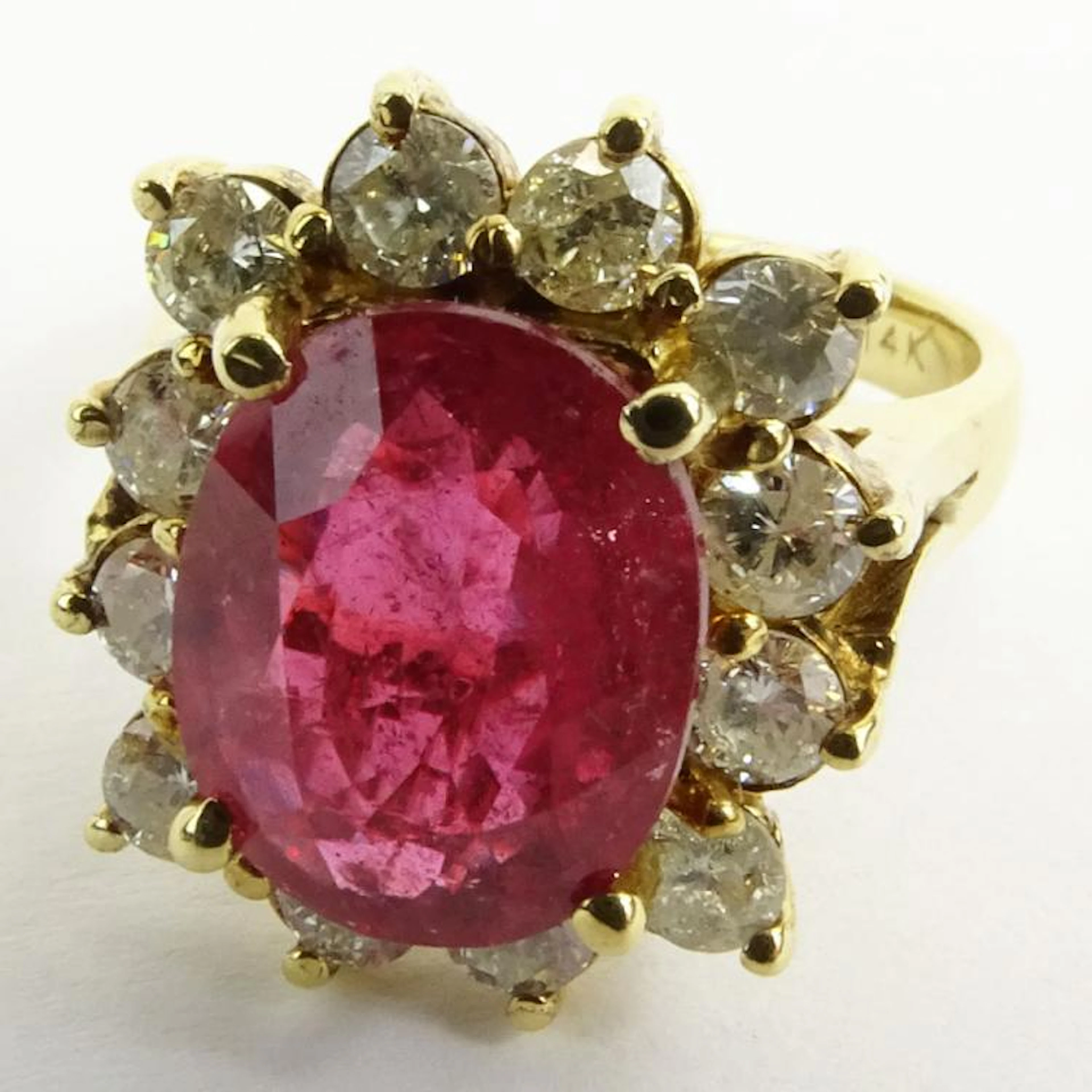 GLA Certified 3.57 Carat Oval Cut Ruby, 1.03 Carat Round Cut Diamond and 14 Karat Yellow Gold Ring. Ruby with vivid saturation of color. Diamonds H-I color, I2 clarity. Signed 14K. Very good condition