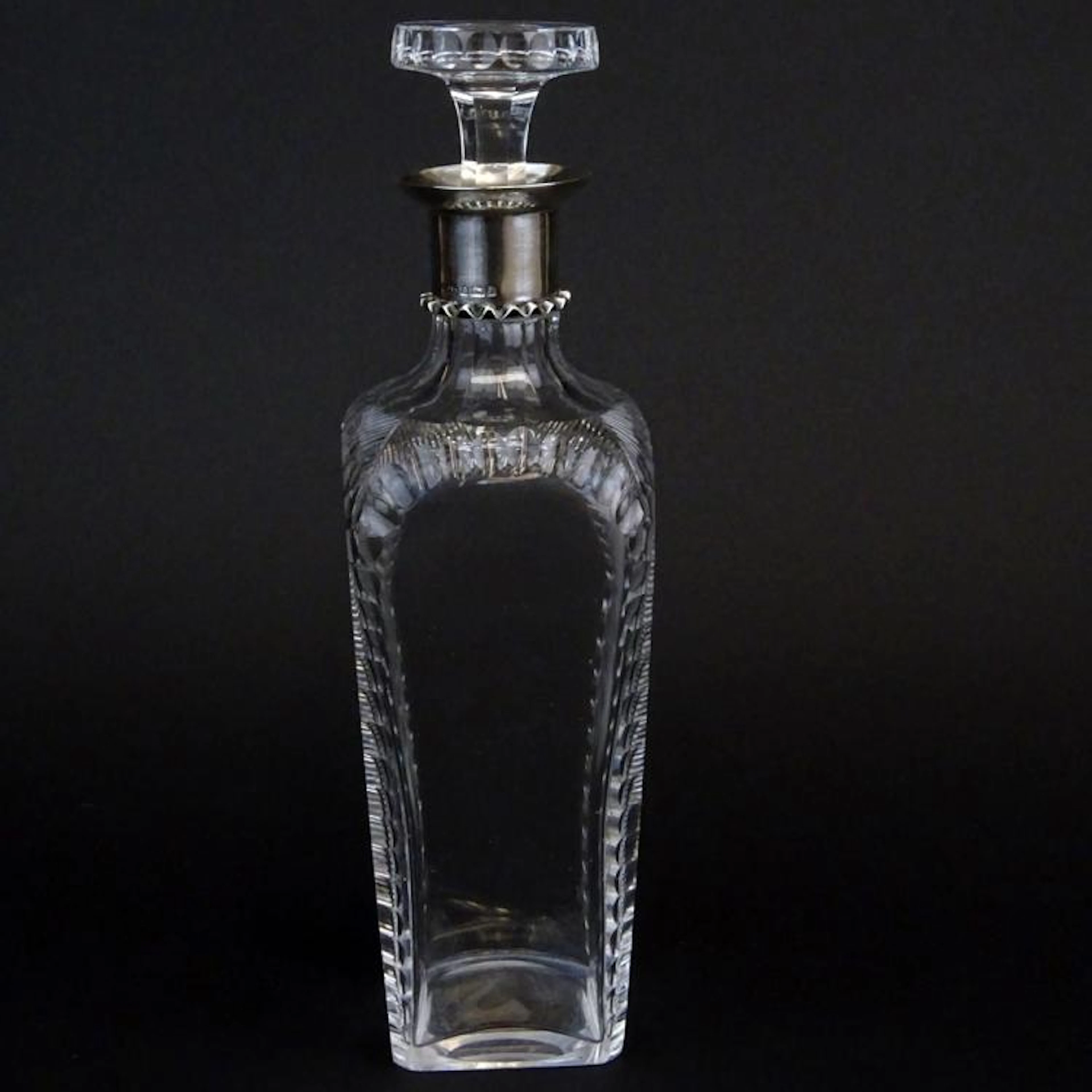 Early 20th Century English Cut Crystal Decanter With Sterling Rim. Cut and polished pontil. Signed with hallmarks, Birmingham 1900. Good condition. Measures 11-1/4" H