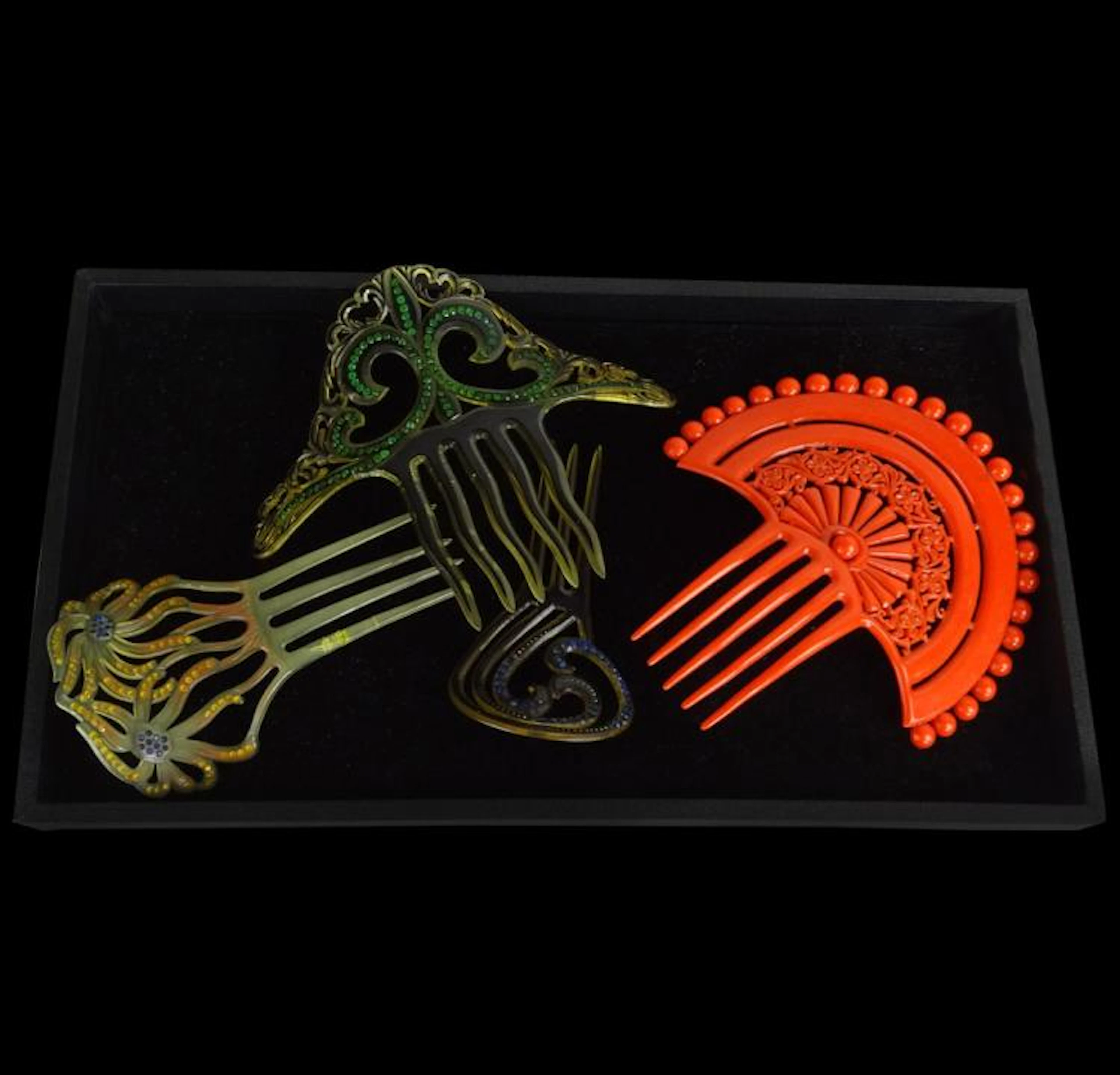 Lot of Four (4) Art Nouveau Celluloid Hair Combs. Unsigned. One comb with a broken tooth. Largest measures 6-5/8" H.