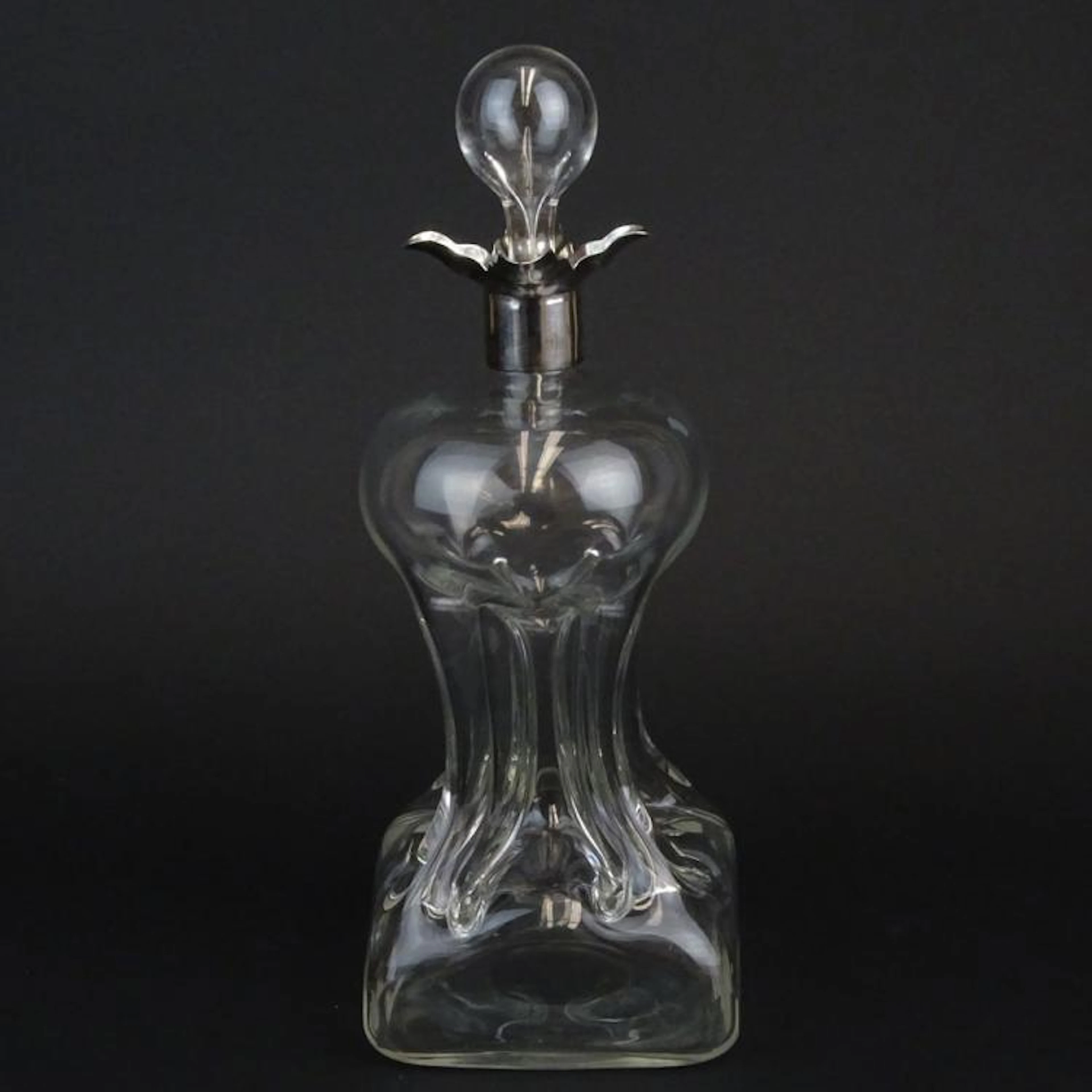 Late 19th Century English Blown Pinched Glass Decanter with Sterling Silver Rim. Polished pontil. Signed with English hallmarks London 1896. Light haze, small chips on stopper end. Measures 13" H