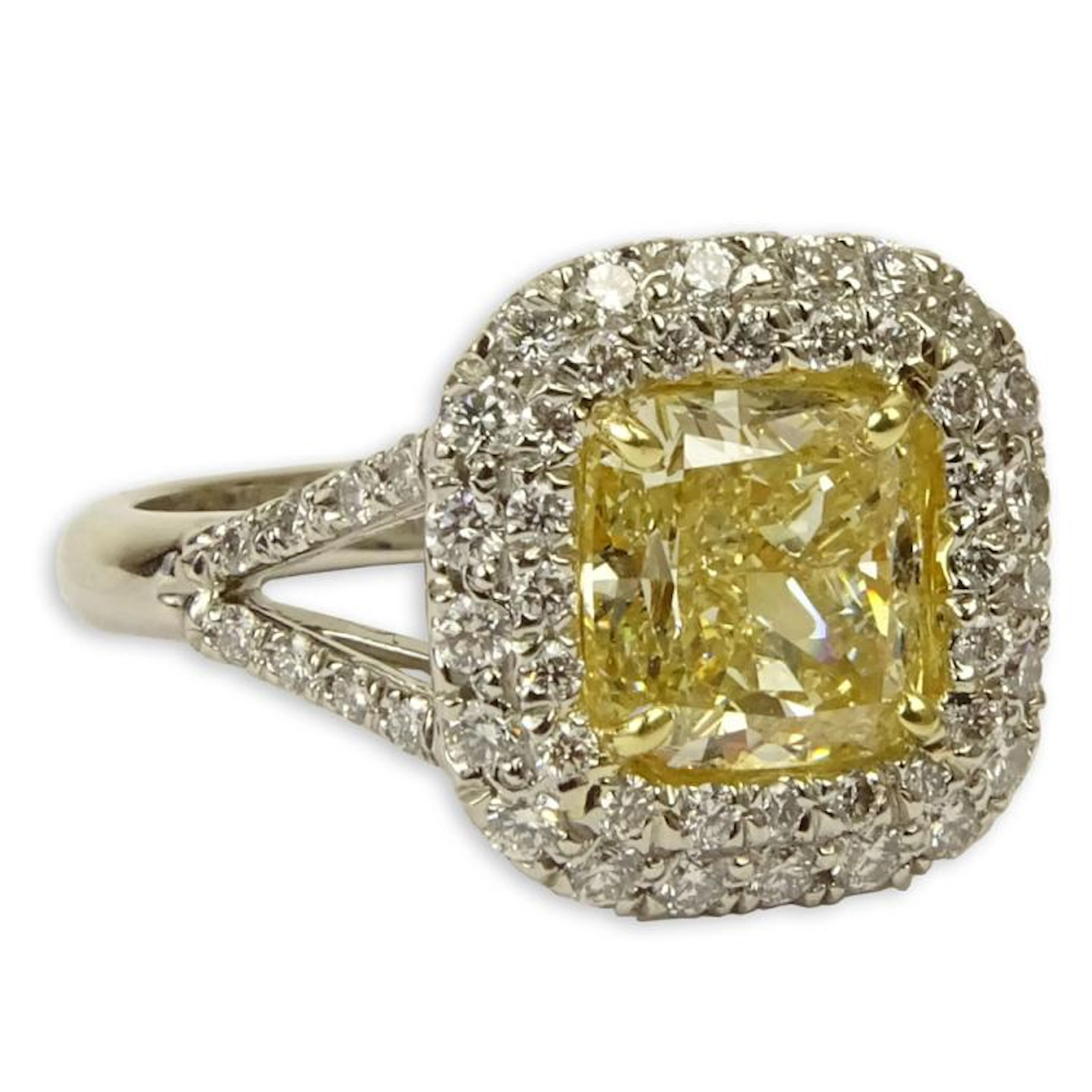 EGL Certified 2.14 Carat Cushion Cut Fancy Intense Yellow Diamond and Platinum Engagement Ring accented with .79 Carat Round Brilliant Cut Diamonds. Yellow diamond SI1 clarity. White diamonds E-F colo