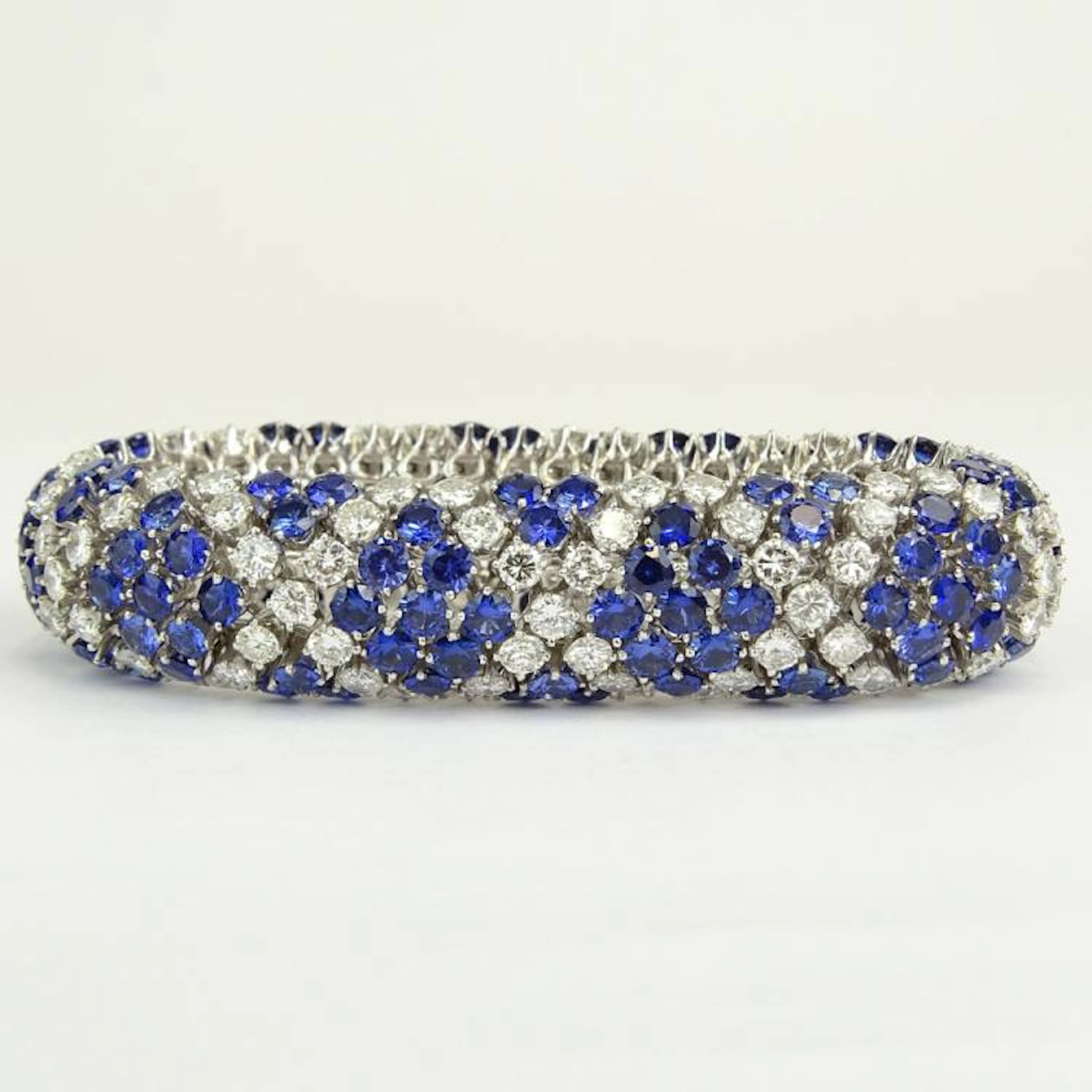 Very Fine Quality Approx. 26.0 Carat Round Brilliant Cut Diamonds, 30.0 Carat Round Cut Sapphire and Platinum Bracelet. Diamonds E-F color, VS1 clarity. Sapphires with vivid saturation of color. Signe