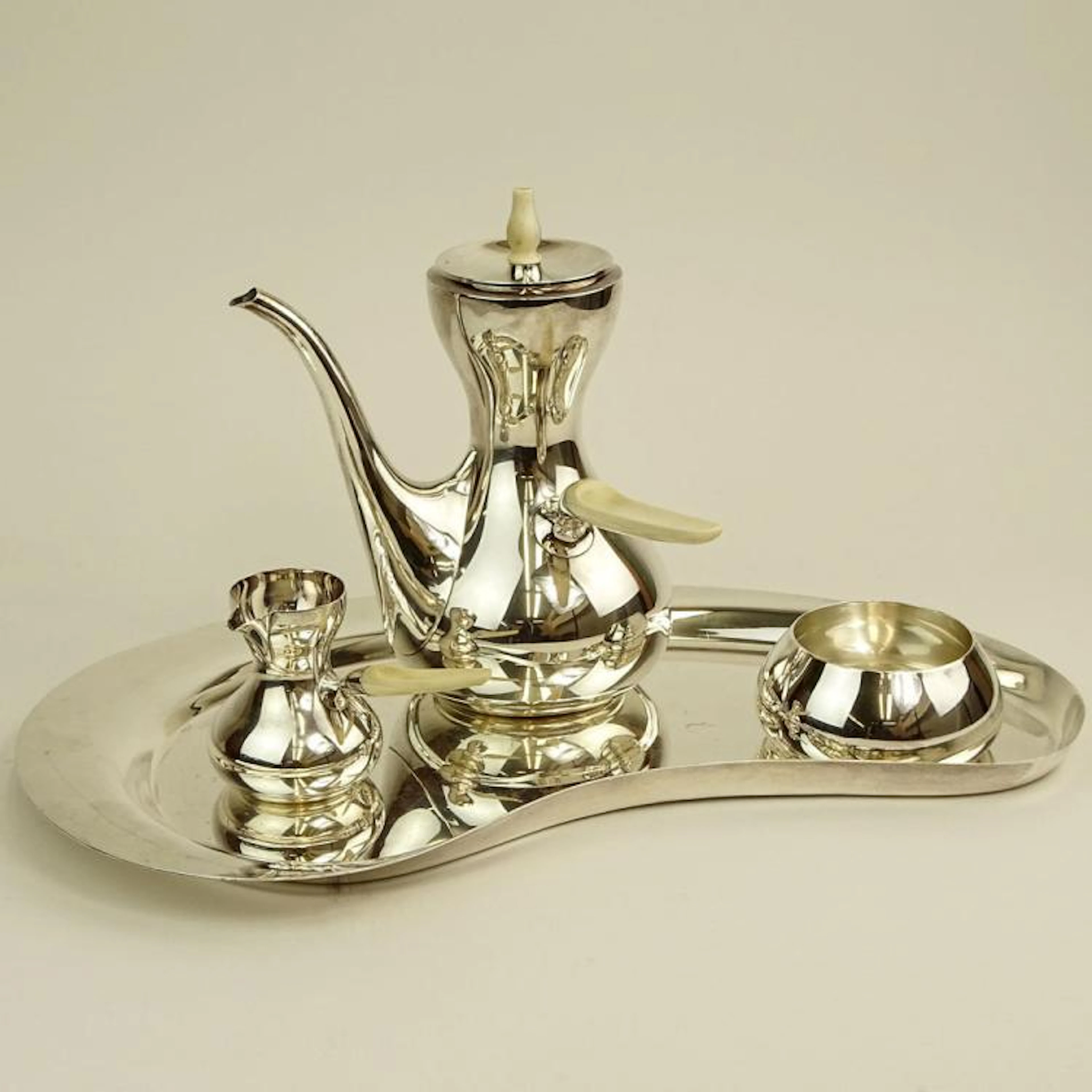 Mid Century Danish Modern Corh Sterling Silver Four (4) Piece Coffee Set. Bone handles and finial. Includes coffee Pot 8-1/4", creamer, open sugar and tray. Signed Sterling Cohr Denmark. Light surface