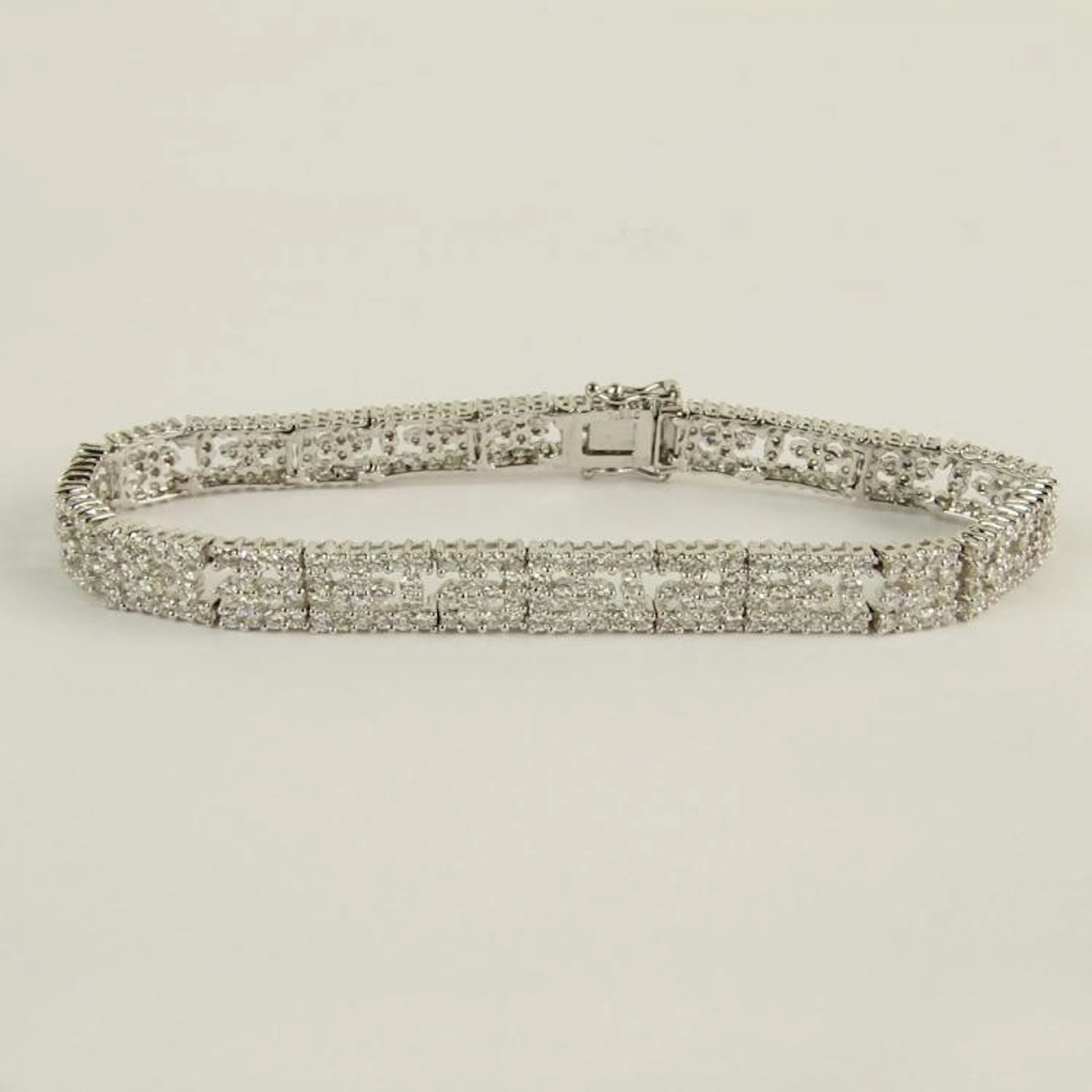Approx. 7.0 Carat Round Brilliant Cut Diamond and 18 Karat White Gold Bracelet. Diamonds E-F color, VS clarity. Signed 18K. Very good condition. Measures 7" L, 1/4" W. Approx. weight: 10.85 pennyweigh