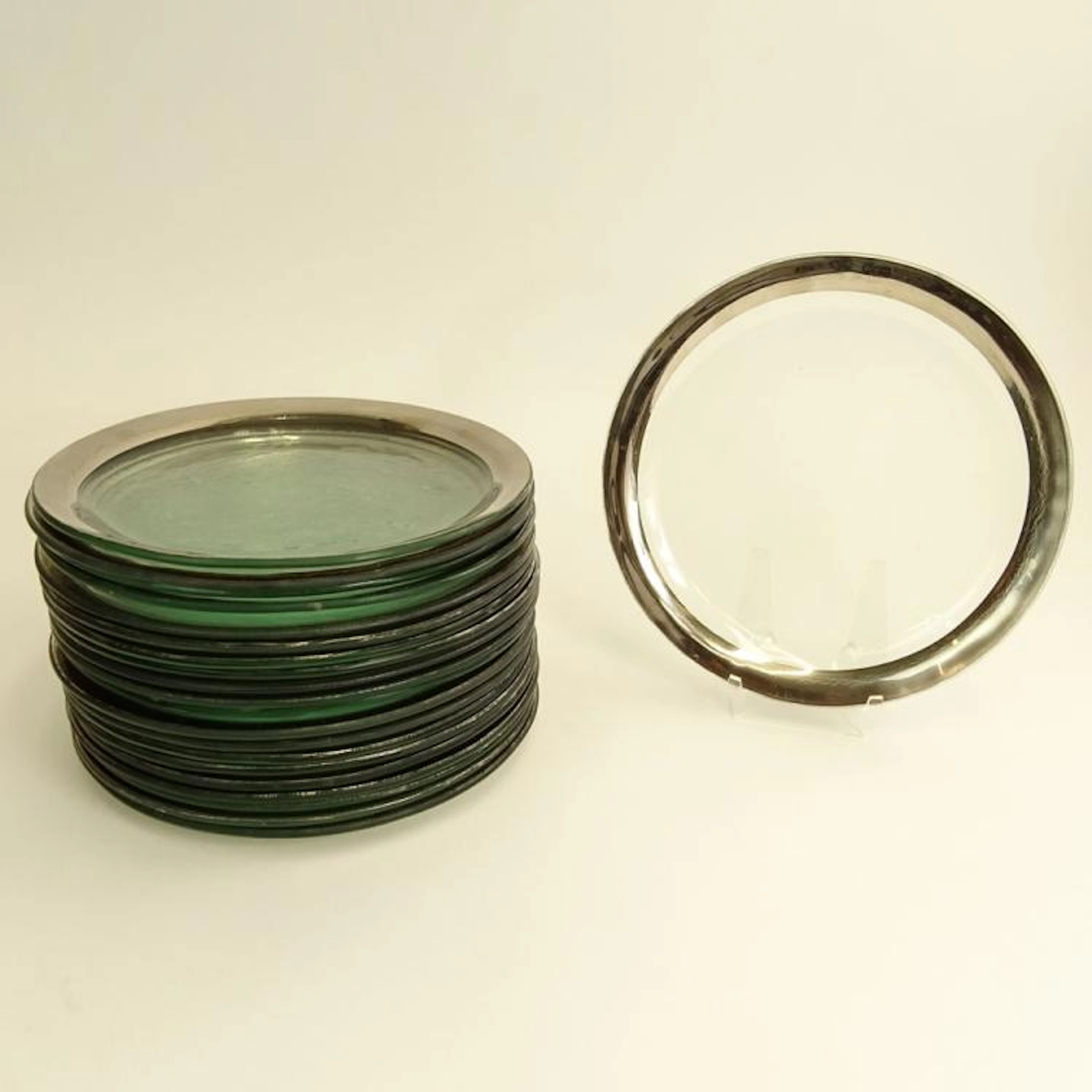 Set of Twenty (20) Annieglass Platinum Trim Dishes. Signed. Wear to trim. Measures 10-1/4" dia.