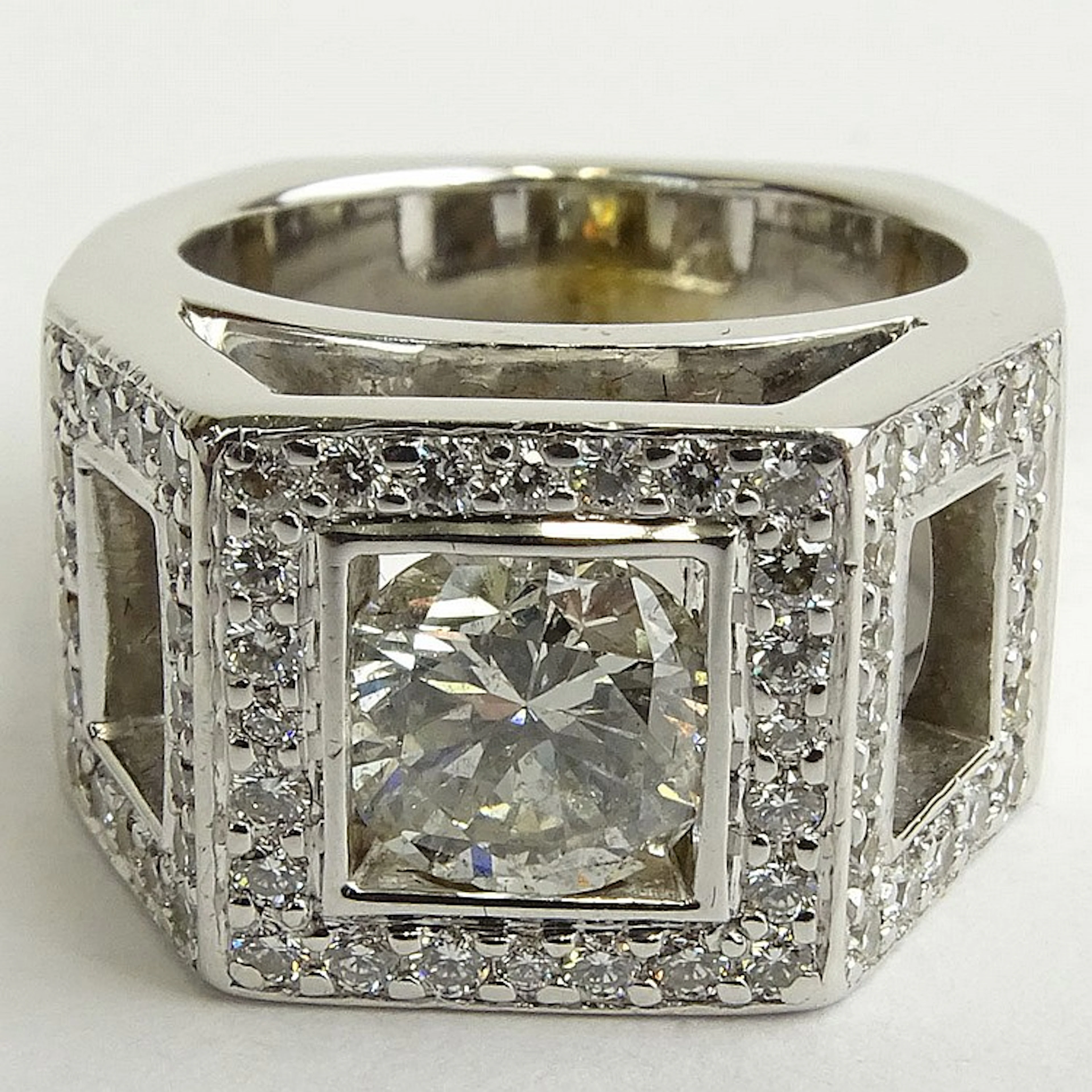 Approx. 1.45 Carat Round Brilliant Cut Diamond and 14 Karat White Gold Engagement Ring Accented with .70 Carat Round Brilliant Cut Diamonds. Center diamond H-I color, SI2 clarity. Accent diamonds F-G 