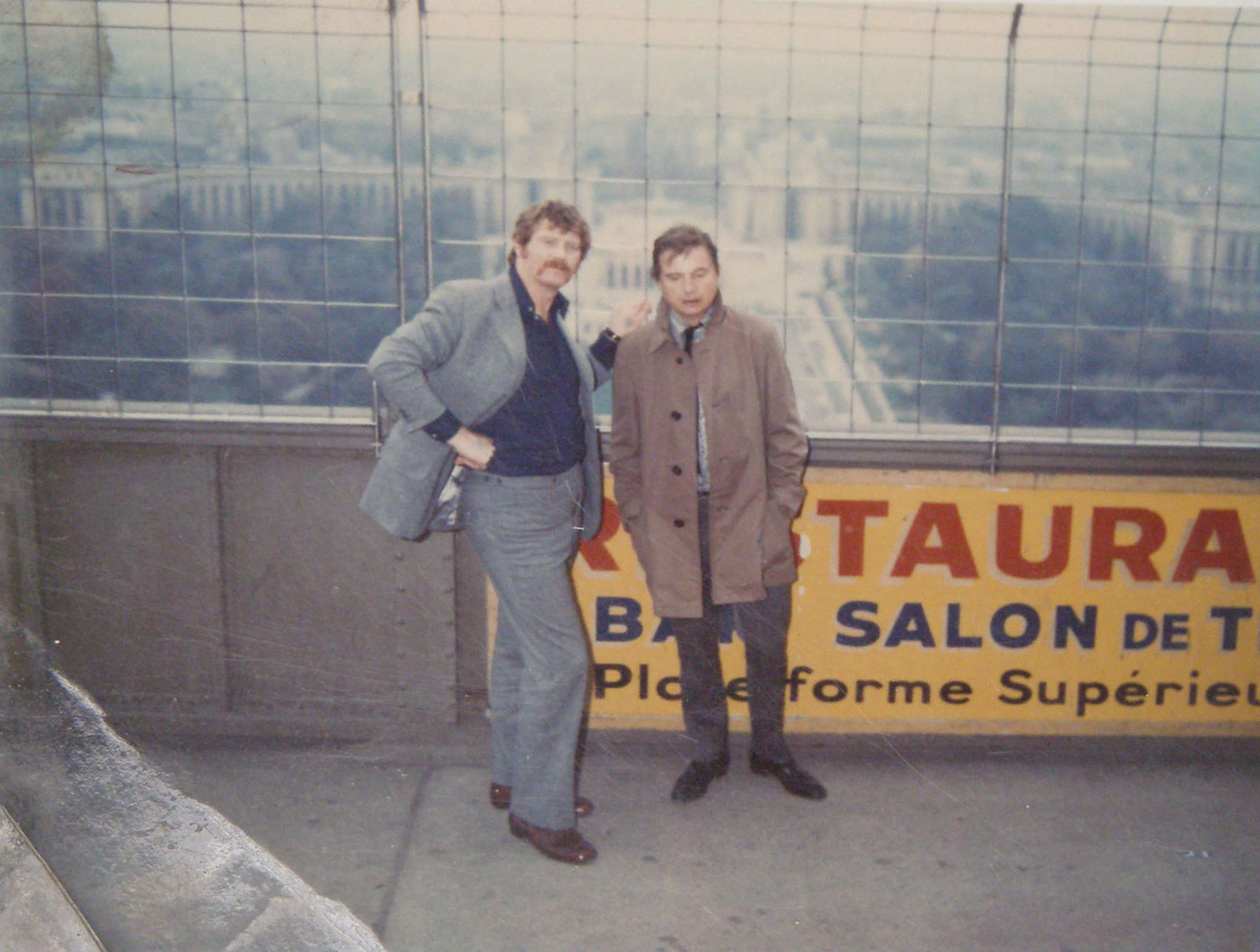 Francis Bacon and a friend up on a platform at the Eiffel Tower. Polaroid coloured photograph