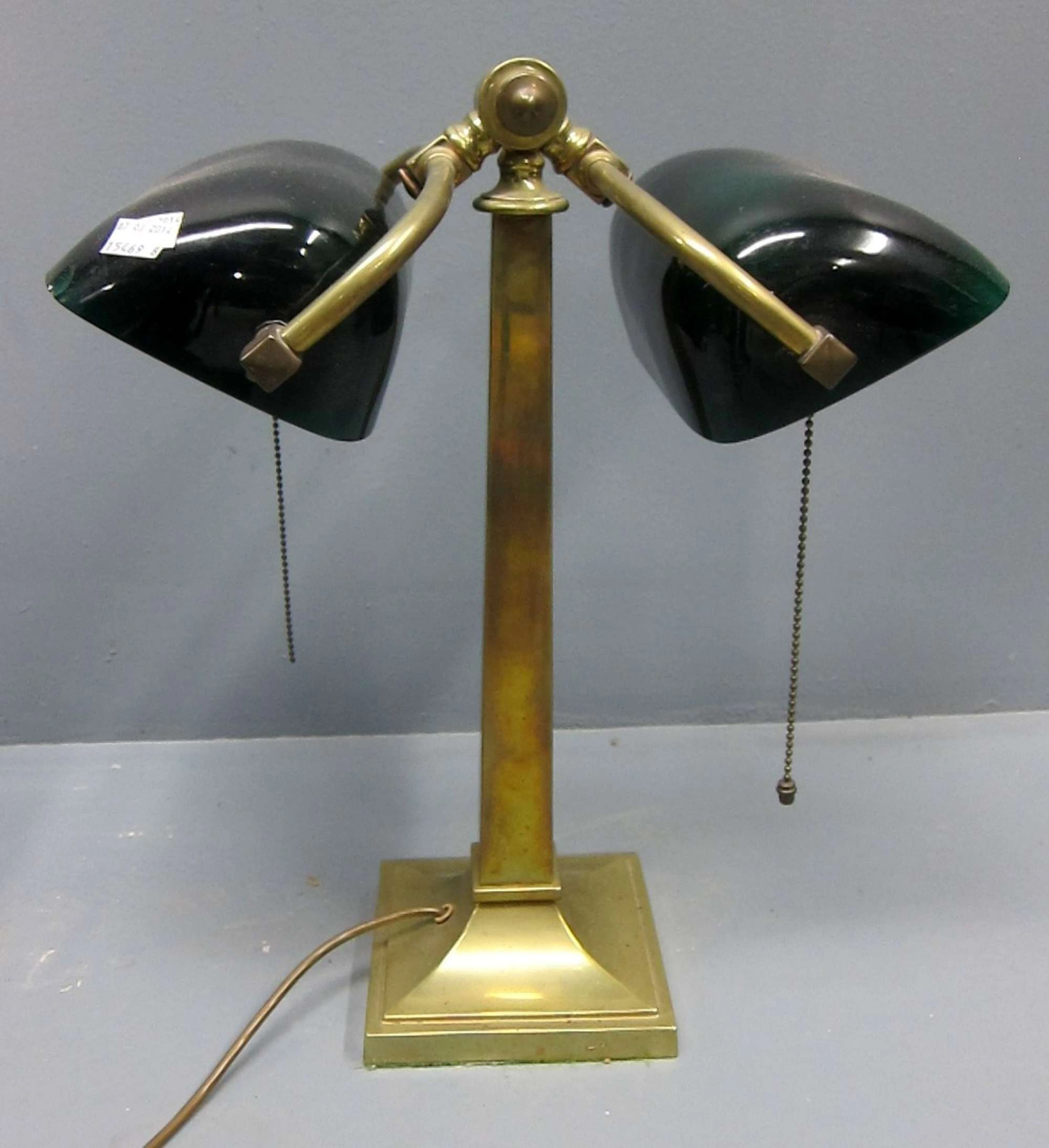 Brass and glass adjustable partners desk lamp with green glass shades