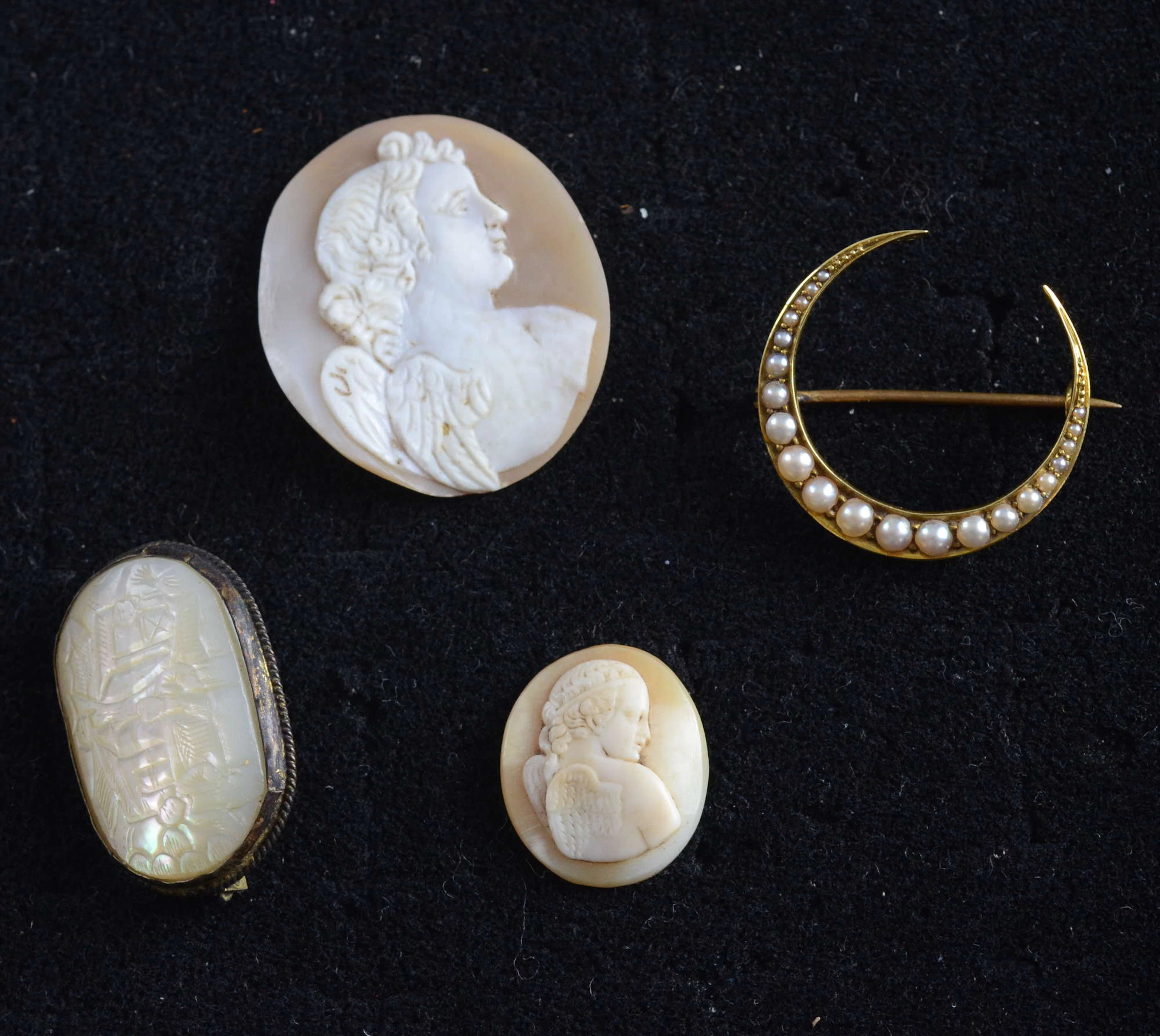 Victorian gold and pearl crescent brooch two unmounted cameos and a carved mother of pearl brooch PROVENANCE: This lot is part of a unique Kipling family archive which has come through Helen Macdonald